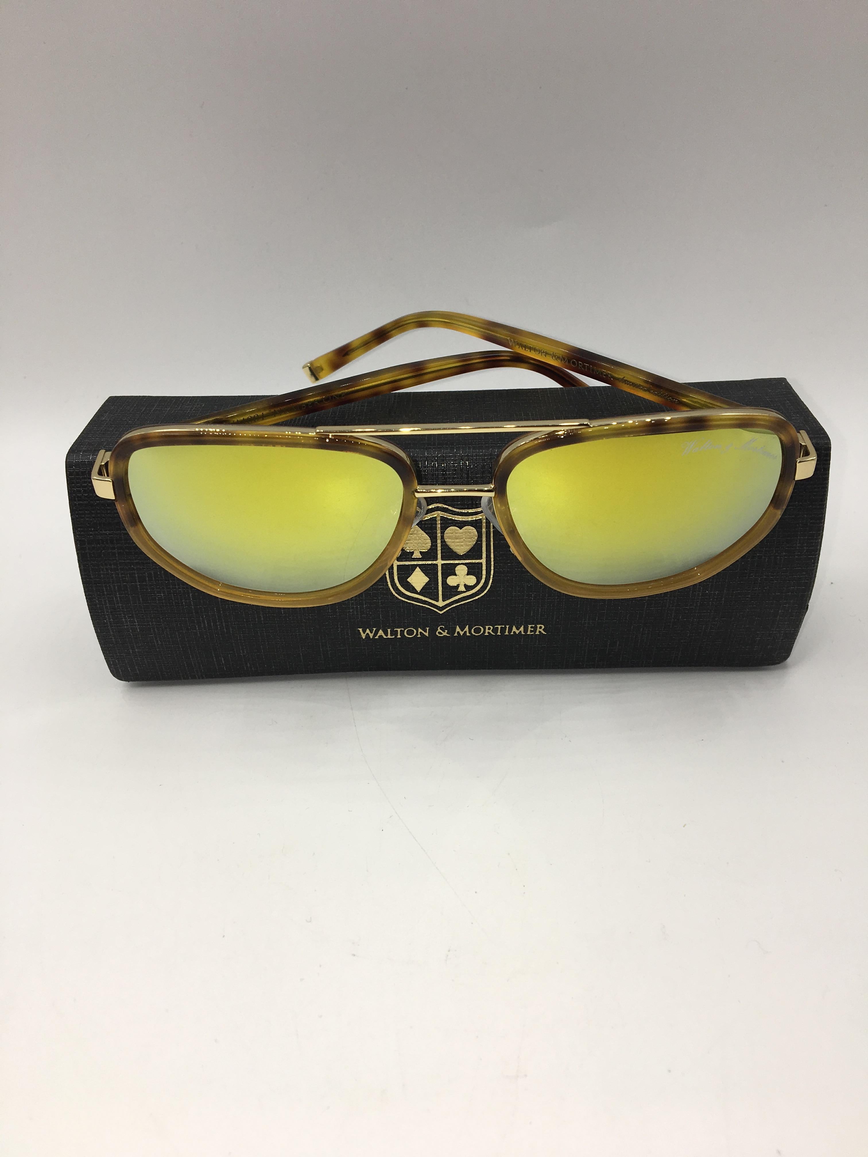 Walton & Mortimer White Sunglasses With gold lenses & gold details.
only 99 units made 
Limited Black box with gold lock.
Cloth with Walton & Mortimer logo
Frame Color Havana
Lens Color: Gold   (100% UV400)