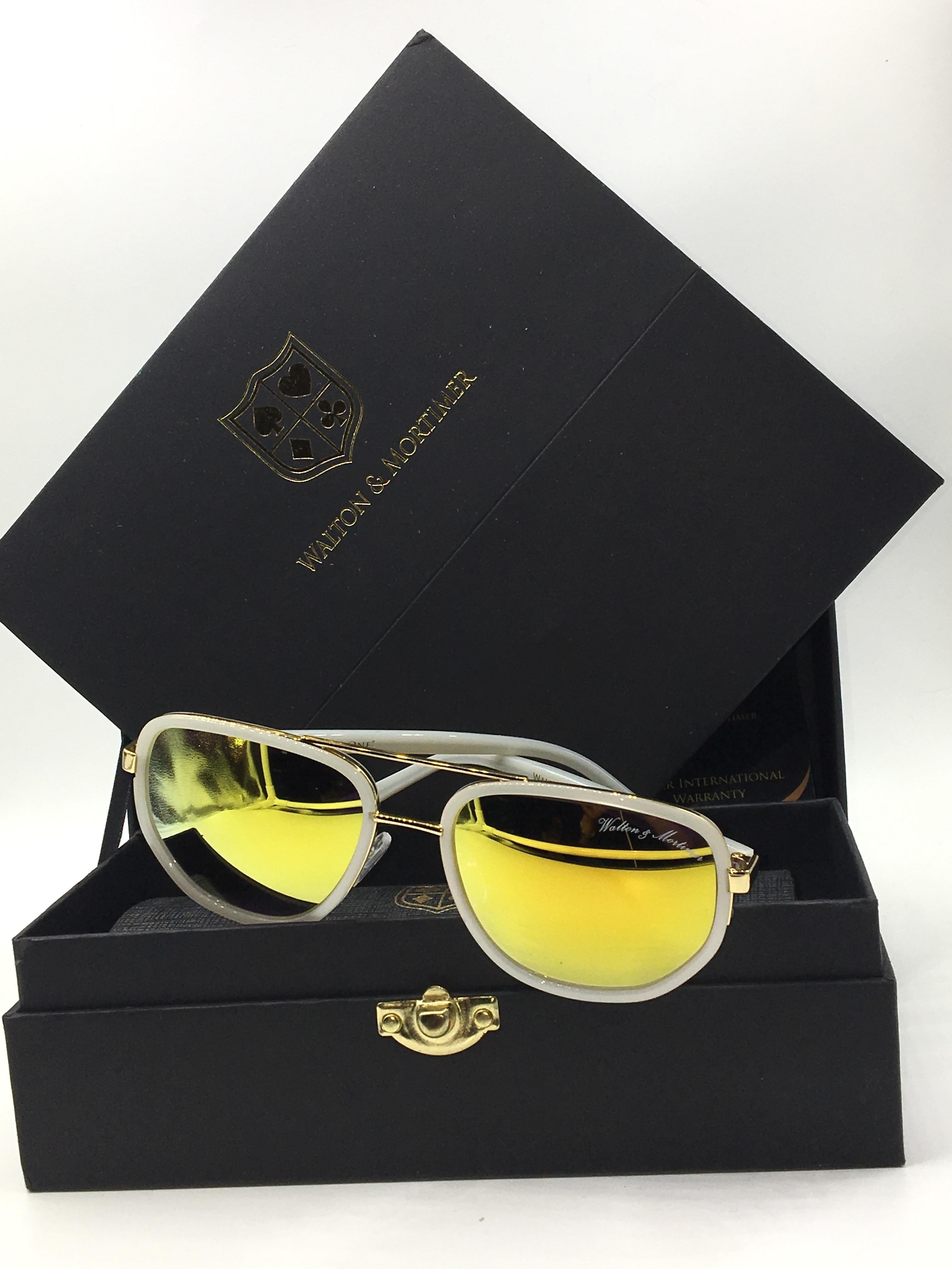 Walton & Mortimer White Sunglasses With gold lenses & gold details.
only 99 units made in White
Limited Black box with gold lock.
Cloth with Walton & Mortimer logo
Frame Color White
Lens Color: Gold   (100% UV400)