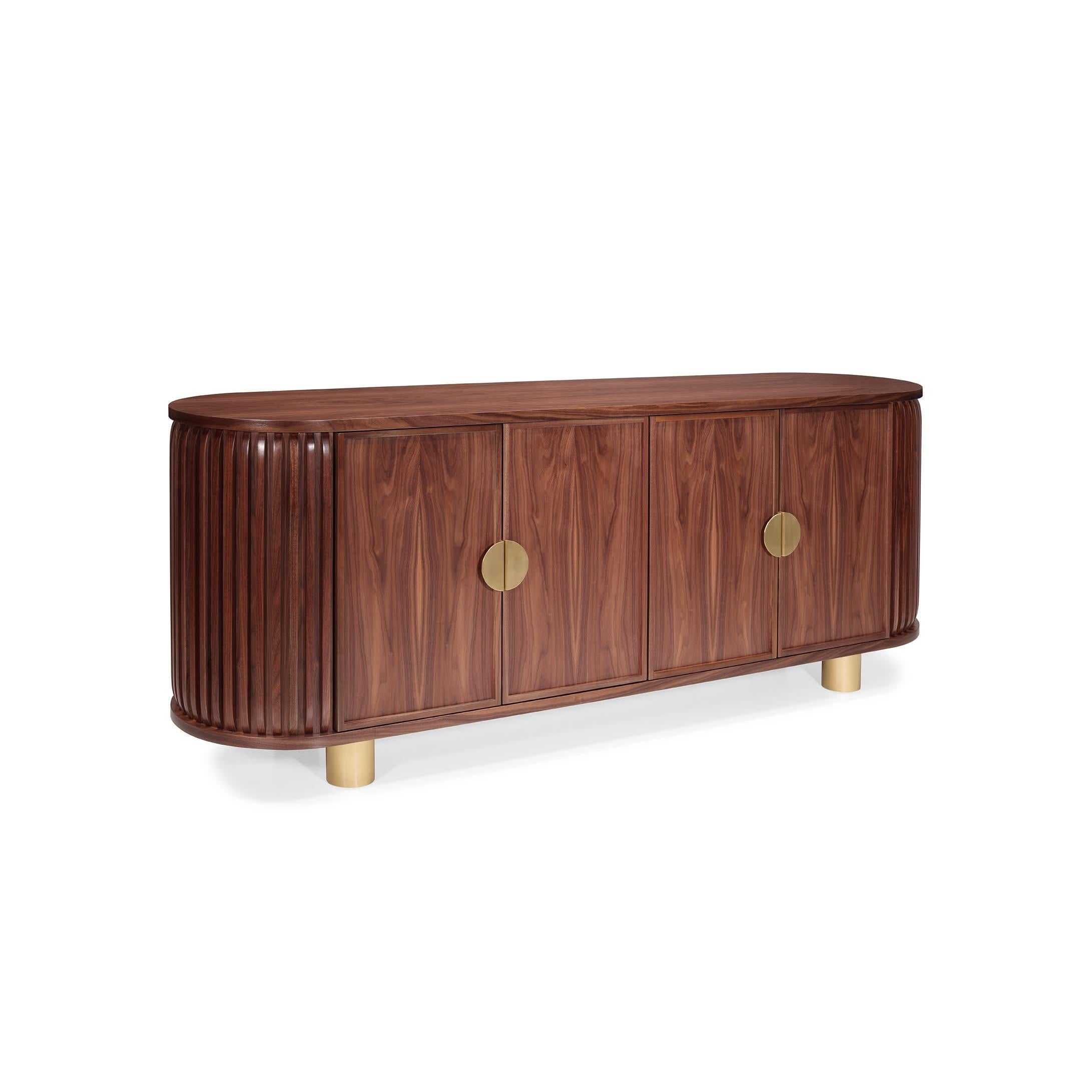 Wanda Sideboard: Sculpted Elegance in Walnut and Brass

The Wanda Sideboard combines the richness of walnut with the sophistication of brass details, creating a piece that stands out for its harmony between form and function. Its curved lines give