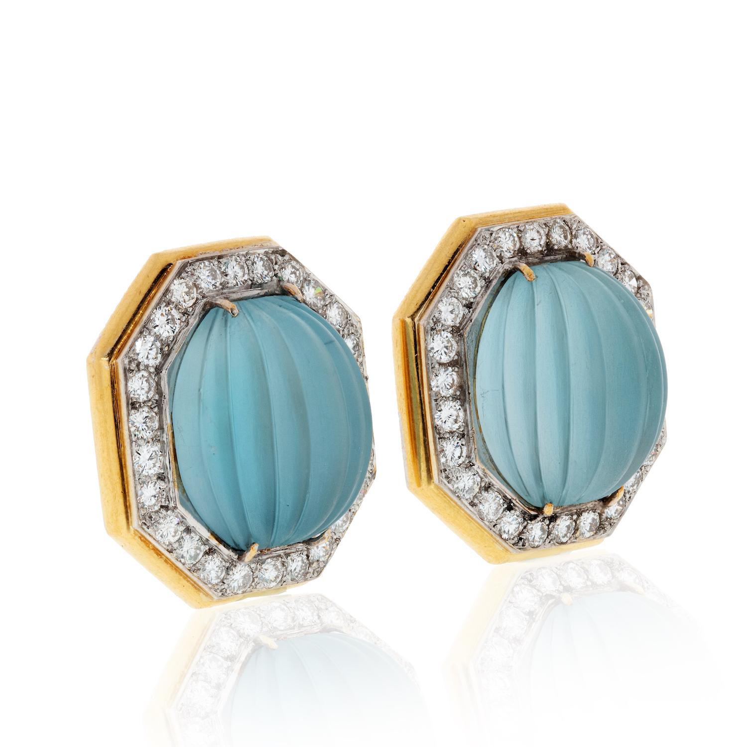 Wander Pair of Two-Color Gold, Carved Aquamarine and Diamond Earclips

Mounted in gold and platinum these wonderful earrings are set with fluted frosted aquamarines and pave round diamonds of approx. 3.10cts.
Aquamarines: light-medium blue color and
