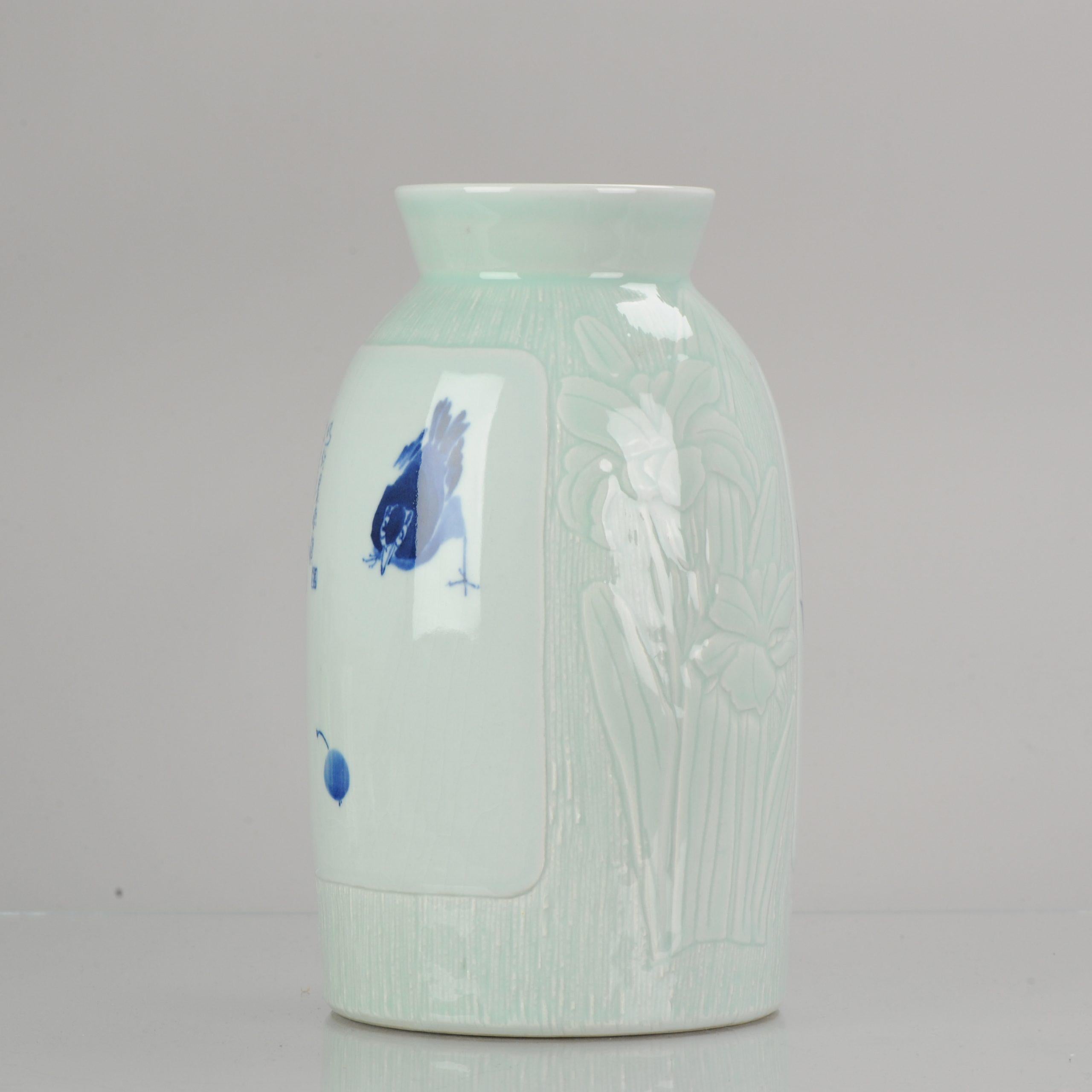 A blue and white porcelain vase, with relief decor of flowers. Dated 2001. Signed Wanglin (1972), Senior Art Artist in Jingdezhen, member of the Jingdezhen Ceramic Art Masters Association. China. H. 31 cm. ???????? “??” ??:2001?