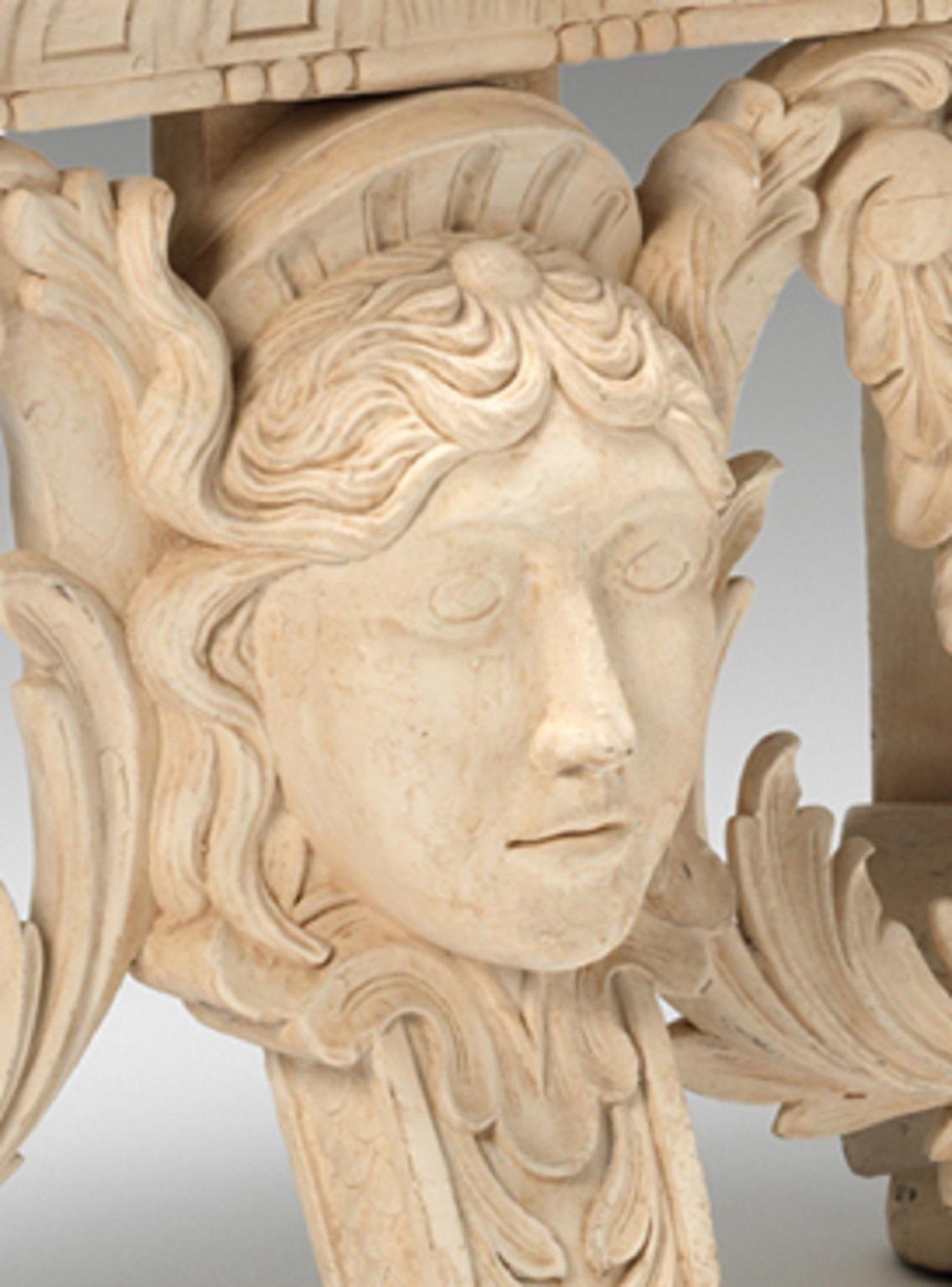 A fine William Kent design banquette seat with carved under frieze supported by S scroll and scale decorated legs, united by floral swags centred by a Kentian face mask. To be upholstered in the clients own material. Bespoke sizing, design