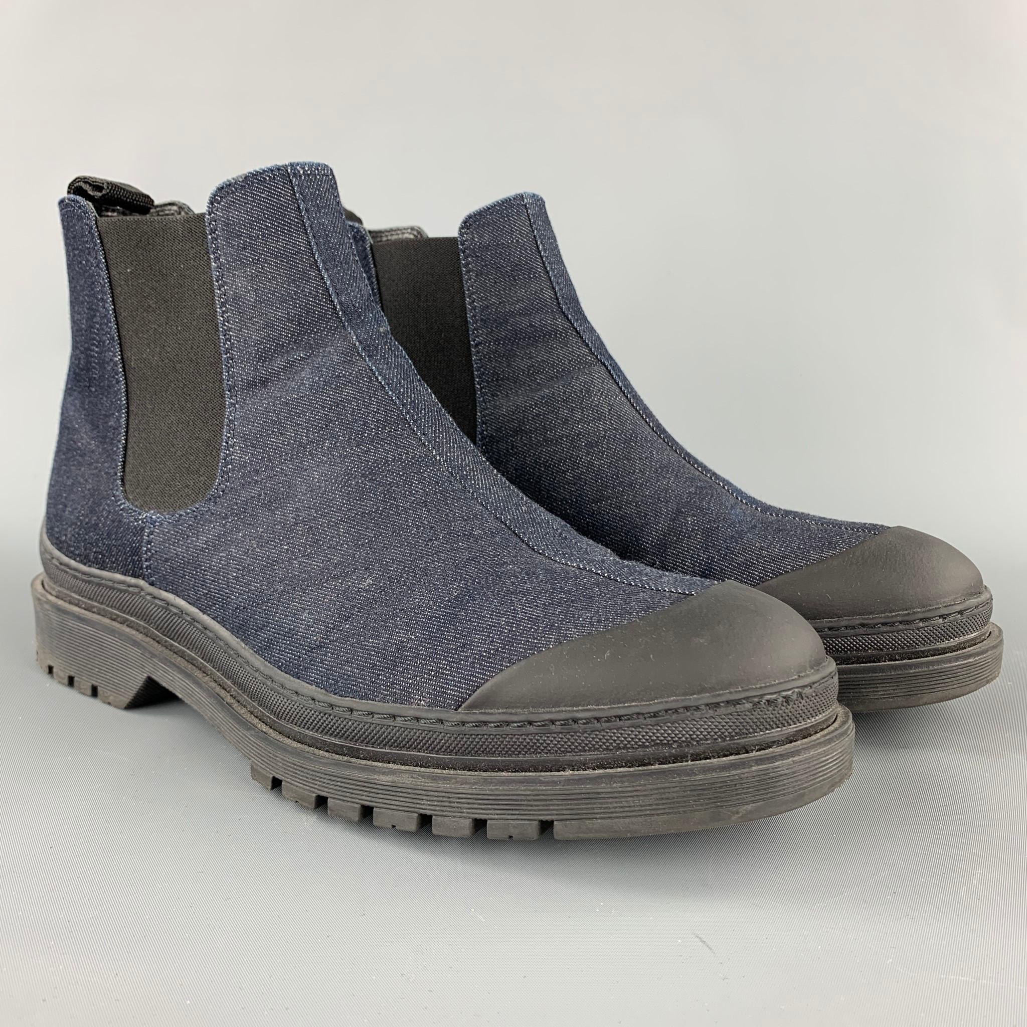 WANT LES ESSENTIELS ankle boots comes in a indigo denim with a black trim featuring a pull on style and rubber sole. 

Very Good Pre-Owned Condition.
Marked: EU 44

Measurements:

Length: 12 in.
Height:  6 in. 