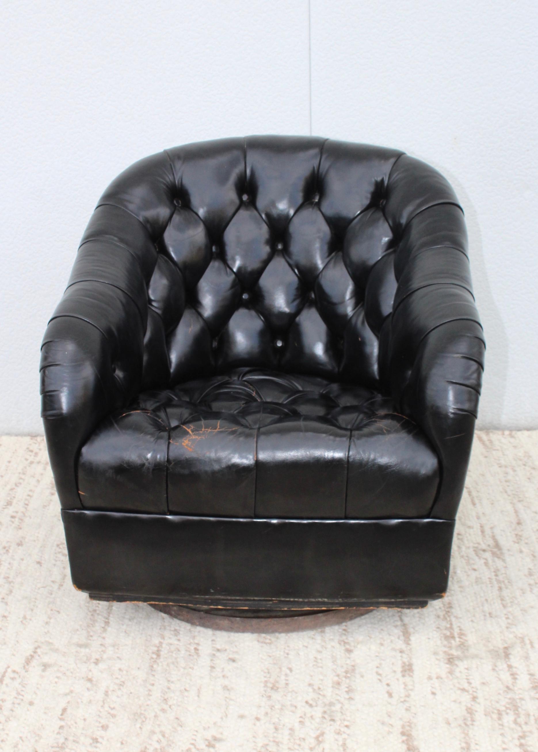 Stunning 1970s distressed leather swivel club chair designed by Ward Bennett.