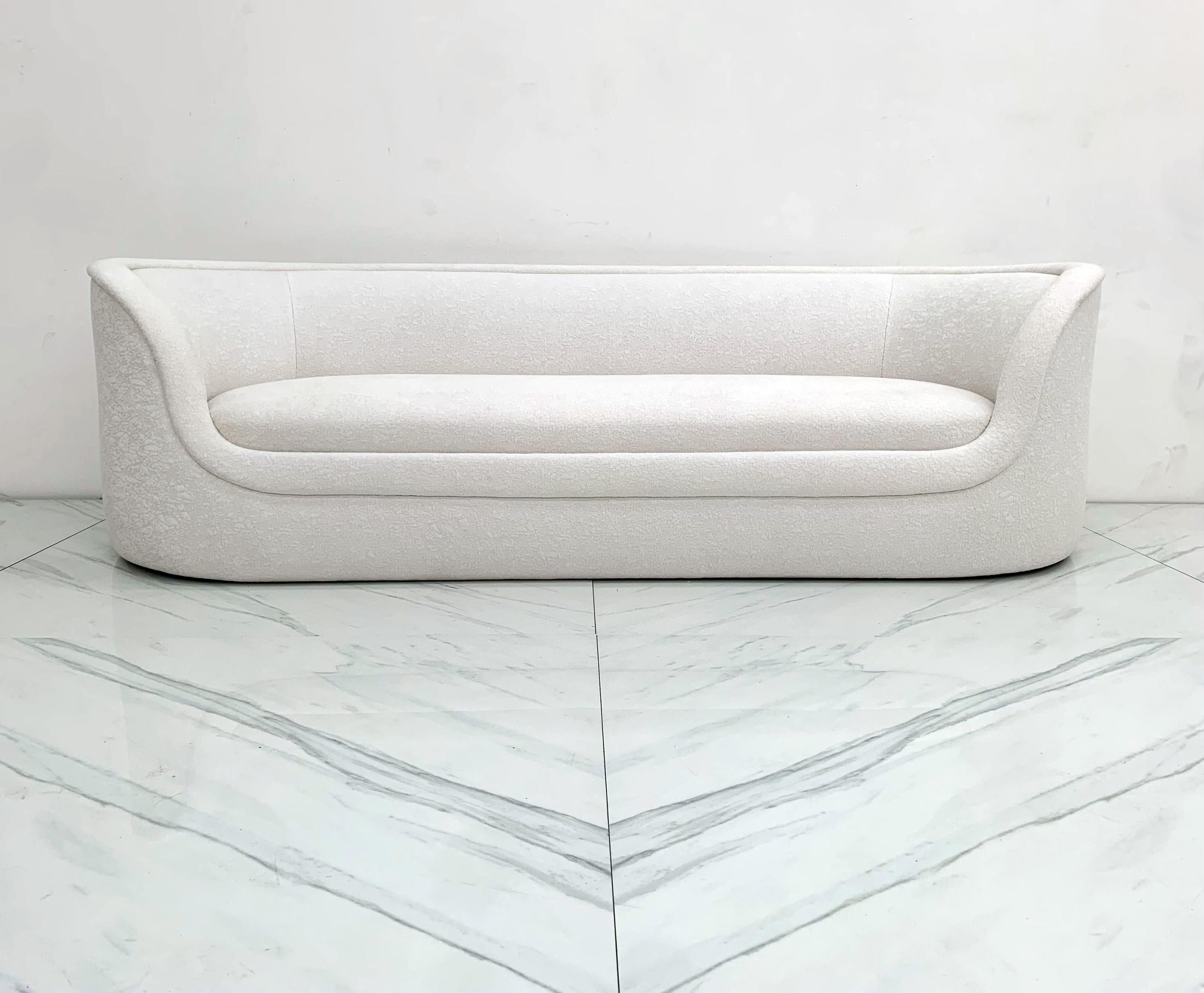 This sofa is absolutely stunning! Designed by Ward Bennet this sleek, curvy sofa or settee is a subtle statement piece that is impossible to not notice. The sofa, named the Cartouche for its sleek oval shape would look incredible in any type of