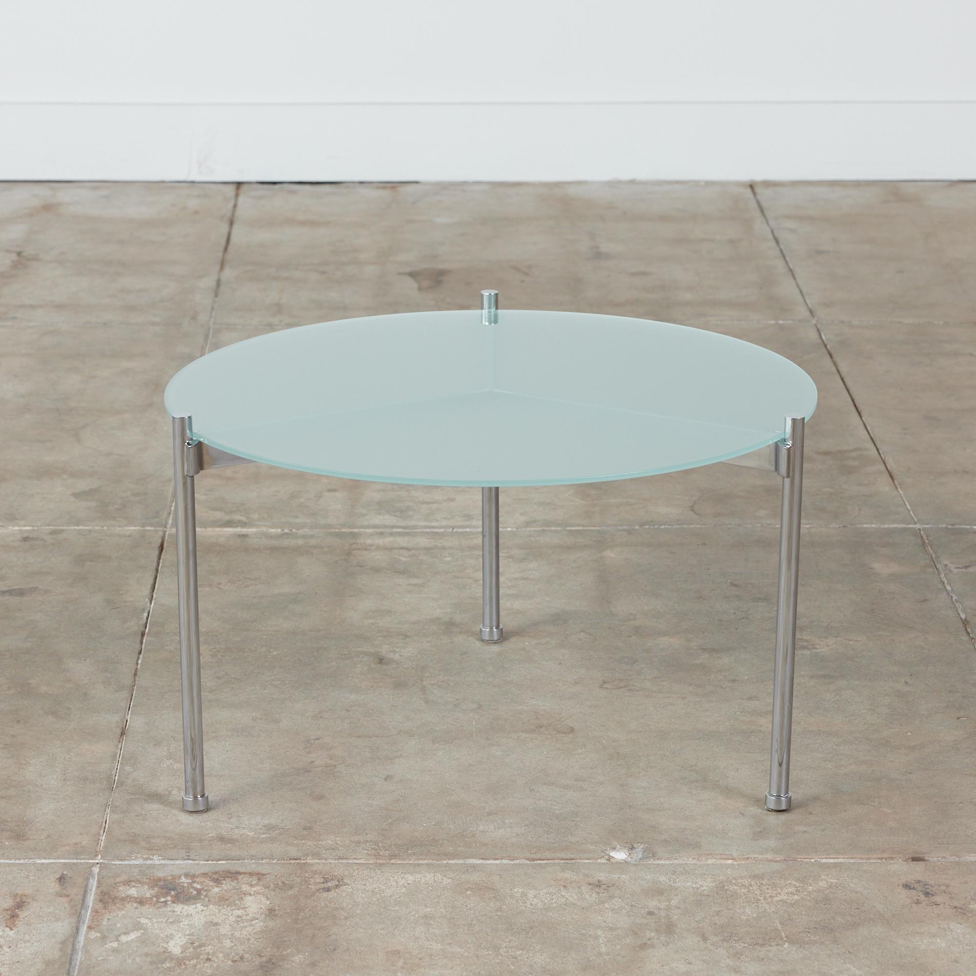 Minimalist side table by Ward Bennett for Brickel Associates, circa 1970s, USA. The round table features a steel chrome plated frame with three tubular legs. The table earned its name from the three stretches that rest just below the glass table top