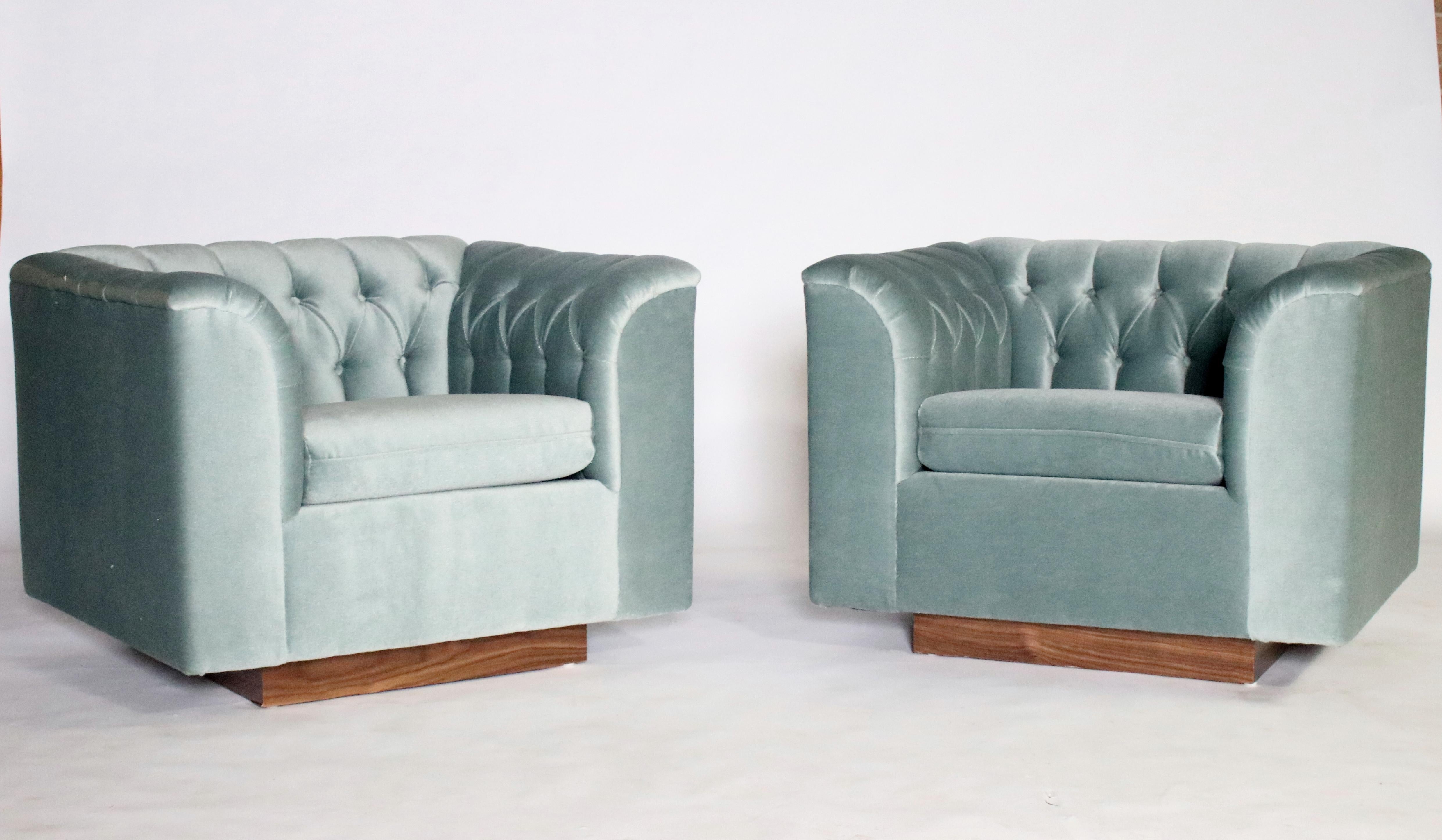 Pair of Ward Bennett cube shaped club chairs on walnut plinths newly upholstered in steel blue gray tufted mohair.