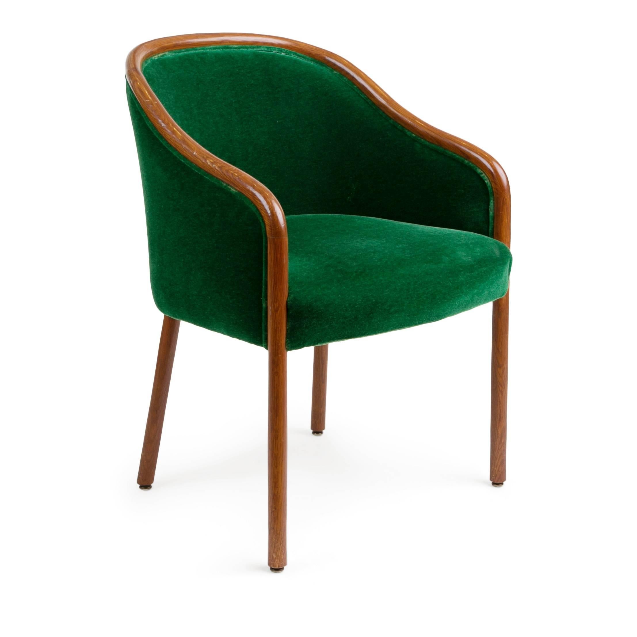 Set of ten Ward Bennett armchairs for Brickel Associates recently procured from the private room of Verlain, West Hollywood. These curvaceous side chairs are upholstered in the original sumptuous emerald green velvet edged in walnut and supported by