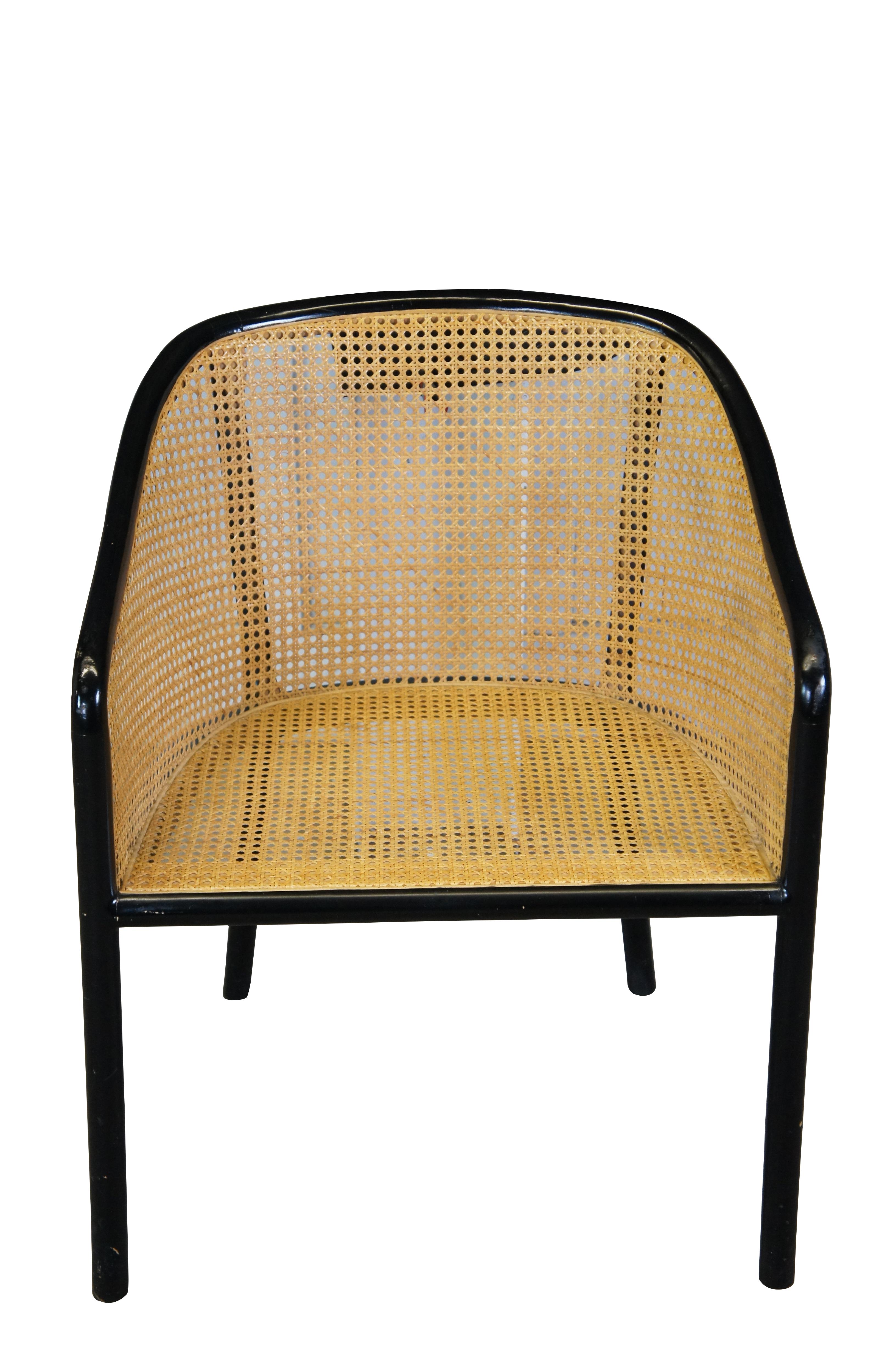 This vintage lounge chair is a variation of Bennett's famous Landmark design, originally designed in 1964 to emulate classic English forms. Structured with a fluid bentwood ash frame, ebonized and caned along all side sides. This iconic armchair has