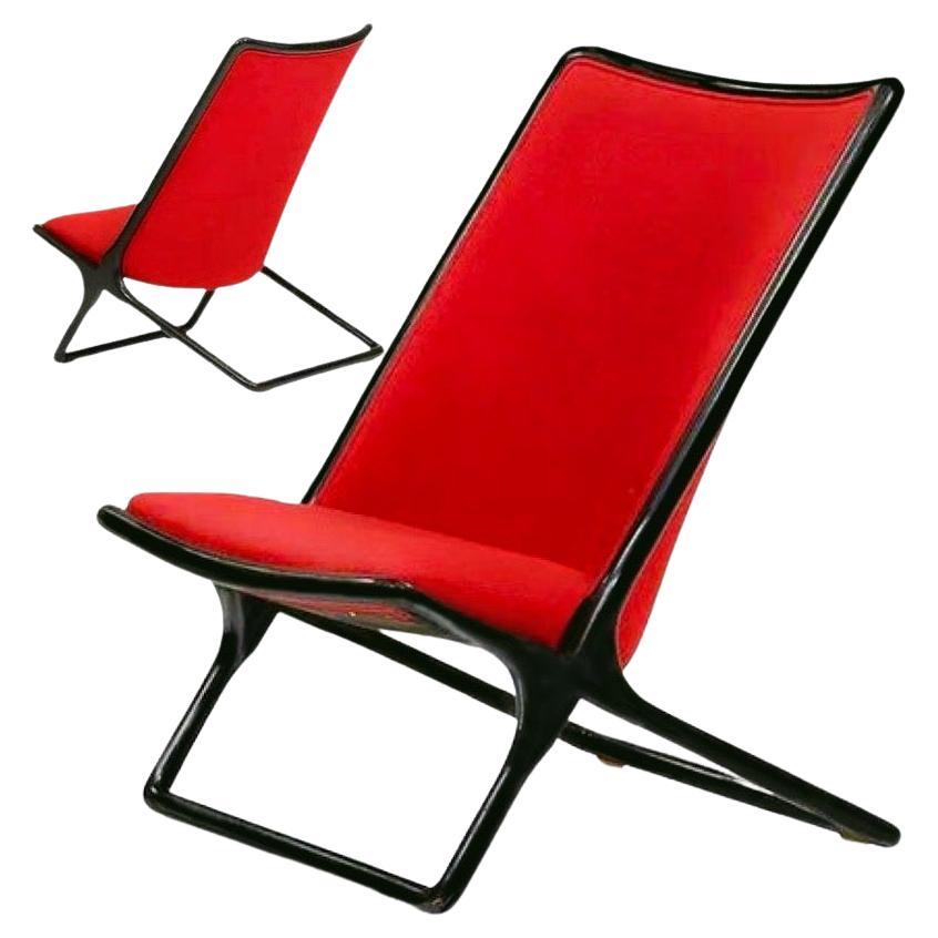 Ward Bennett for Brickel Assoc. black Ash Scissor Lounge Chair, Red Wool Bouclé, 1984, New York. 
Black lacquered ash, red wool upholstery, metal tags to each.

Ward Bennett’s story is a remarkable one. His career began at age 13, when he quit