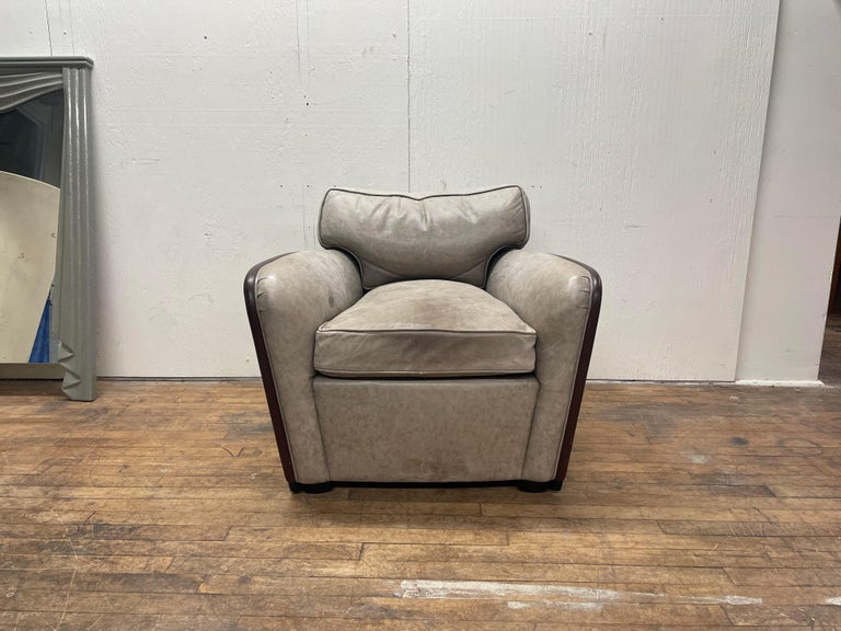 Beautiful leather club chair designed by Ward Bennett for Brickel. This chair is SO comfortable. The leather upholstery is supple and the cushions are very soft. The dark brown trim around the edges of the chair are also made of leather. The chair