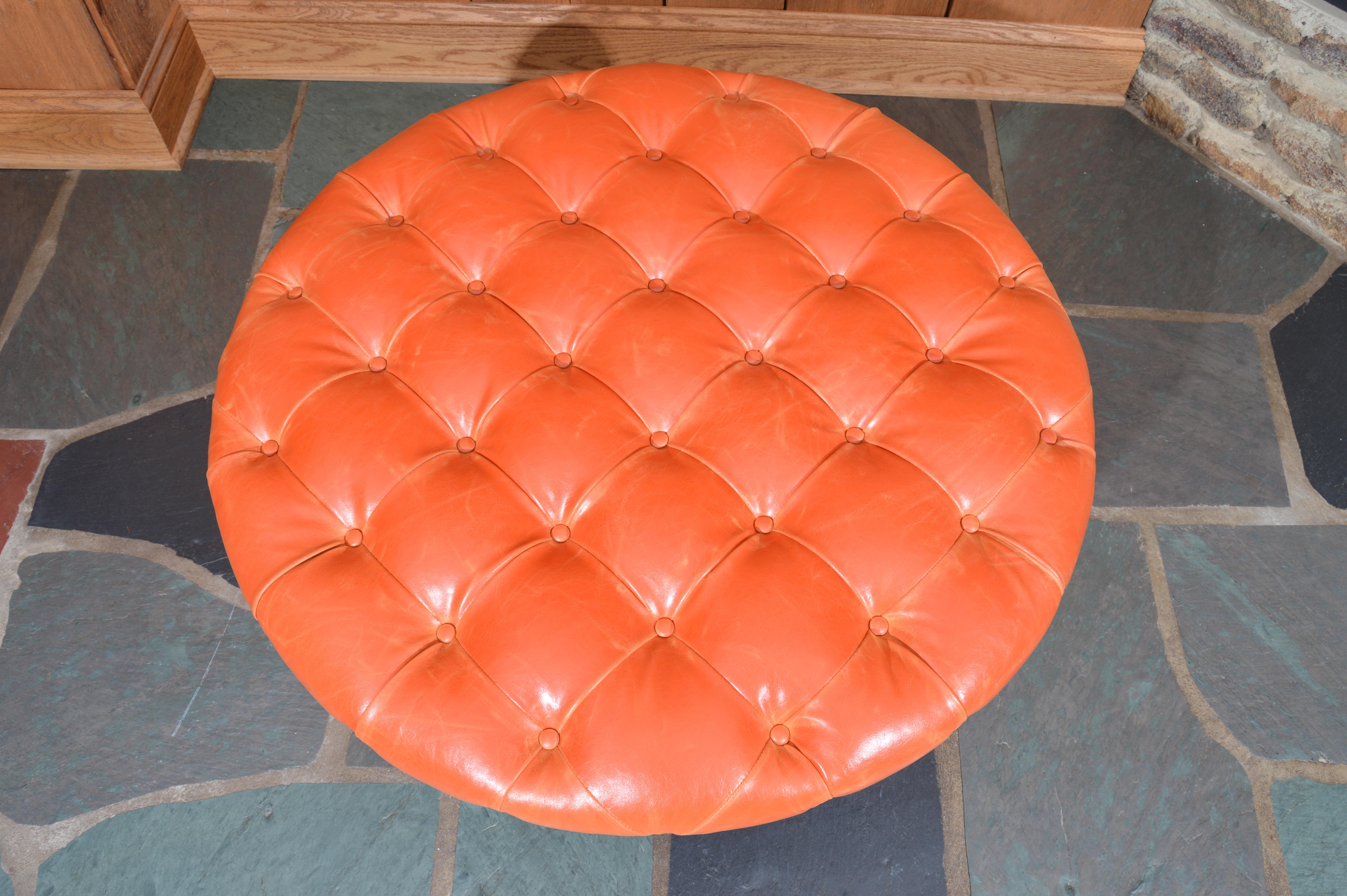 orange tufted ottoman