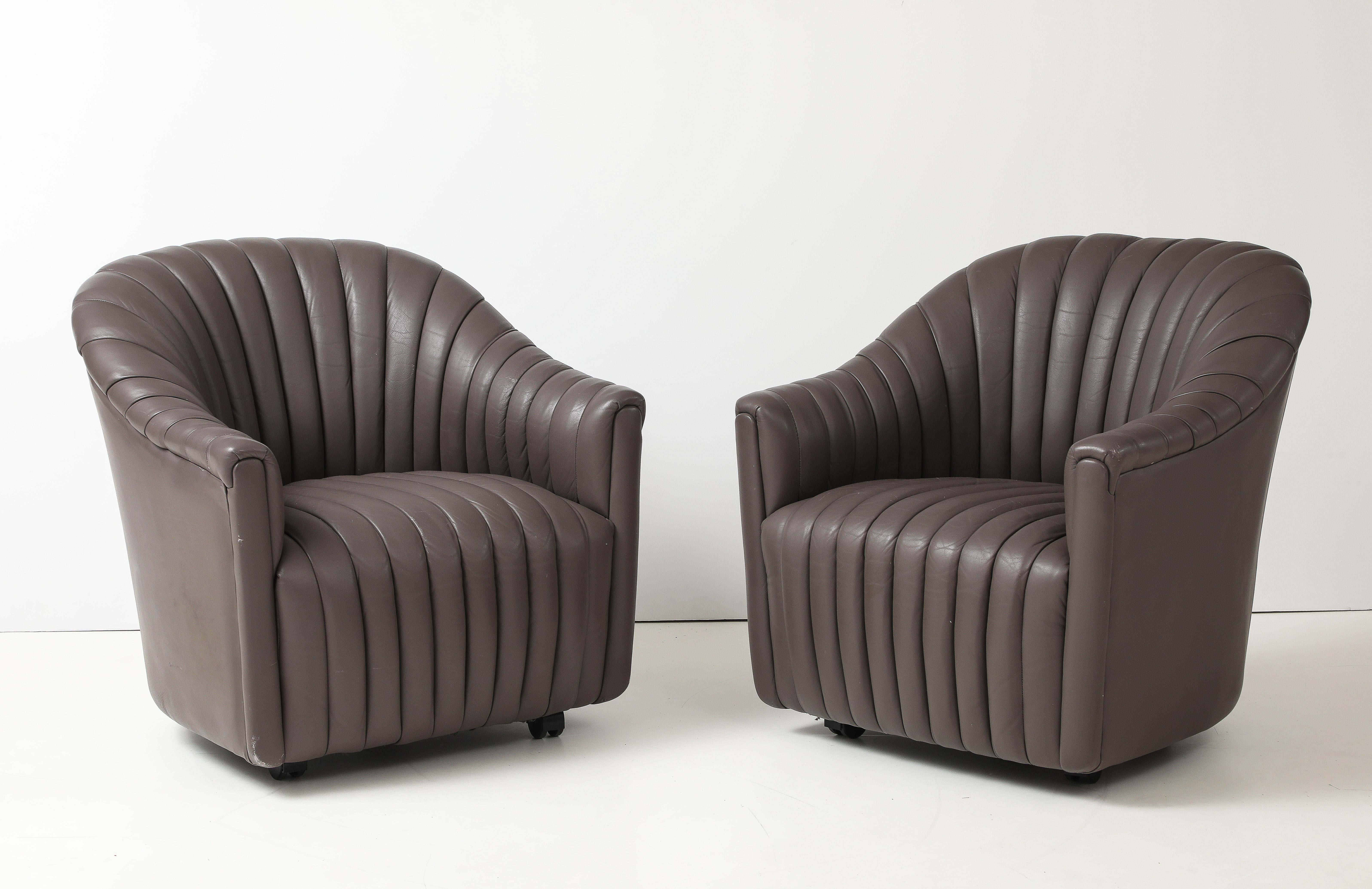 A great comfortable pair of beautiful taupe, gray brown soft leather channel chairs designed by Ward Bennett. Great condition.
Biography:
Designer, artist, and sculptor Ward Bennett was born in 1917 in Washington Heights, NY. He studied at Académie