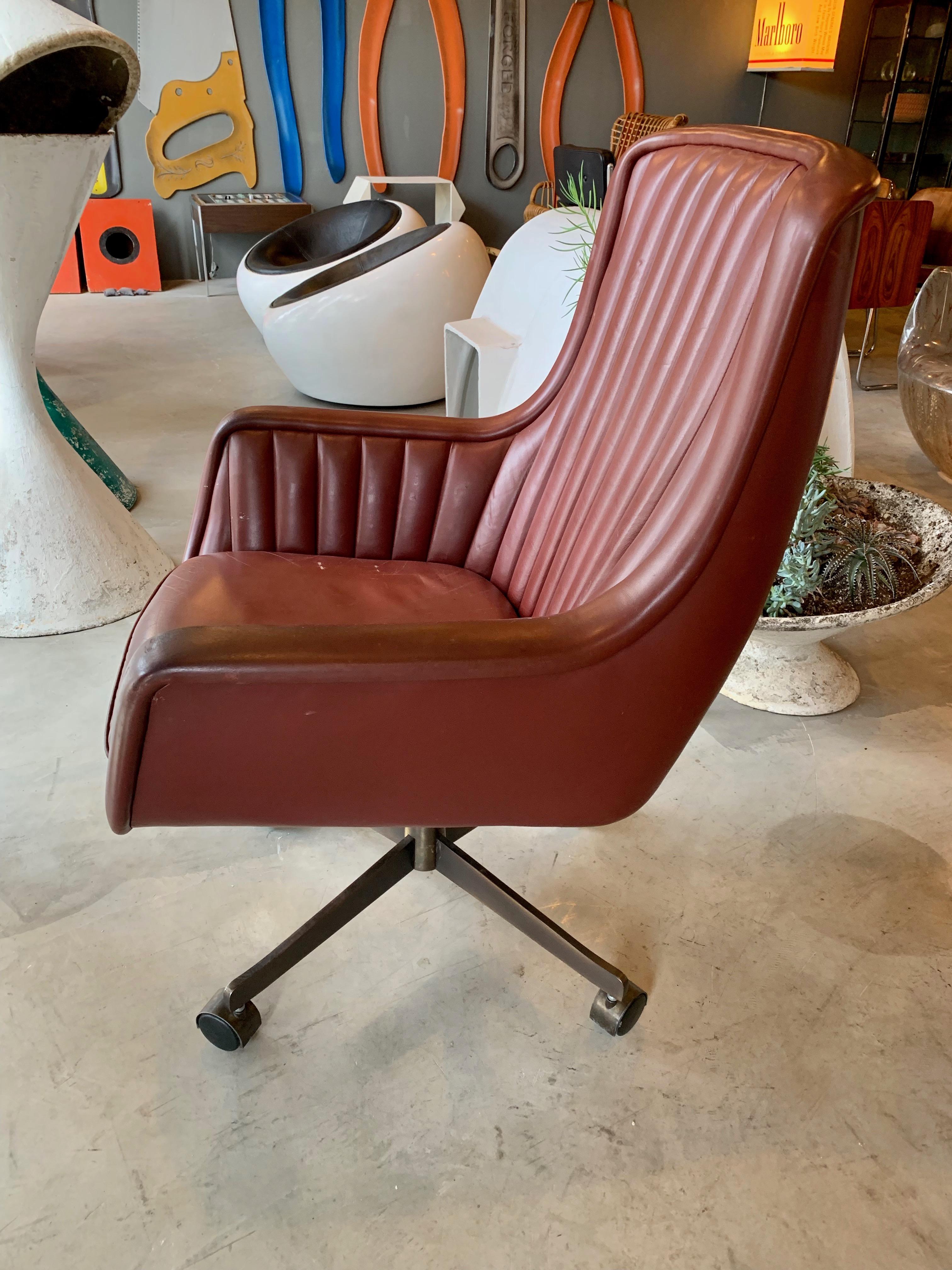 Elegant leather desk chair by Ward Bennett for Brickell Associates. Original tags dated 1984. Oil rubbed bronze base. Reclines and swivels. Height is adjustable. Great vintage condition. Terribly comfortable.