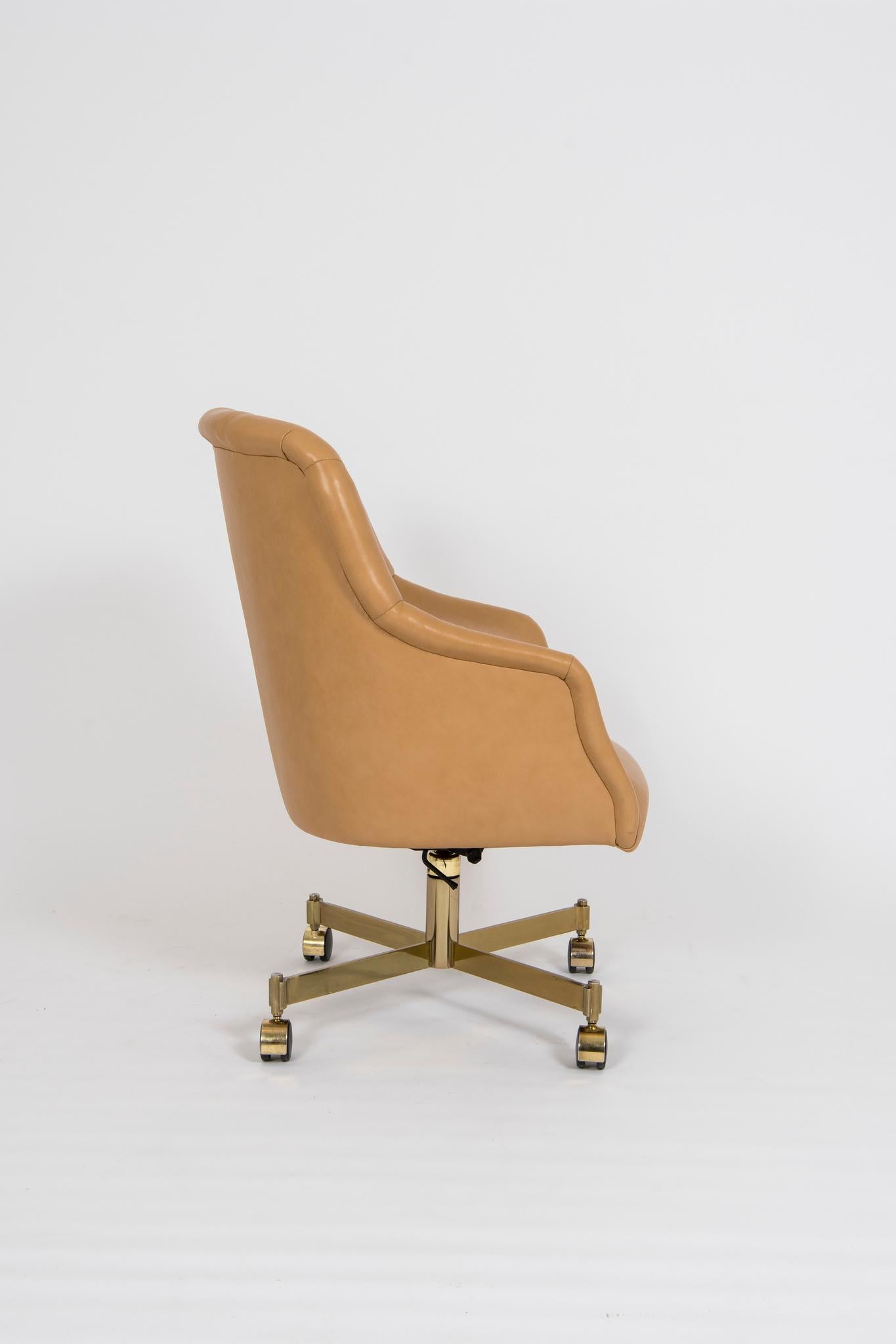 A vintage Ward Bennett for Brickel office or conference chair with brass spindle base newly upholstered in a buttery soft Palomino Italian leather.



  