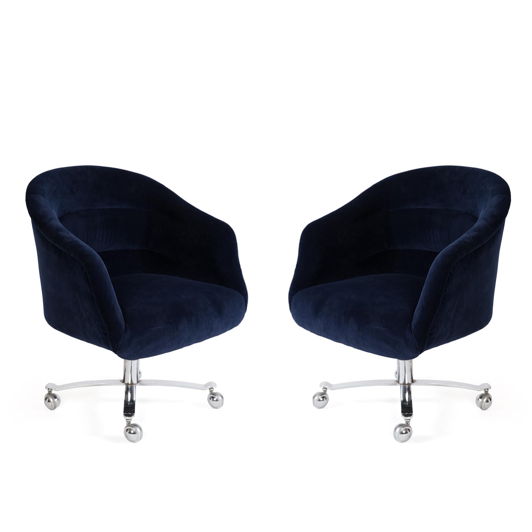 Pair of Ward Bennet office chairs, circa early 1970s. These examples have mirror polished chrome bases and have been newly upholstered in a navy mohair. Price listed is for the pair.