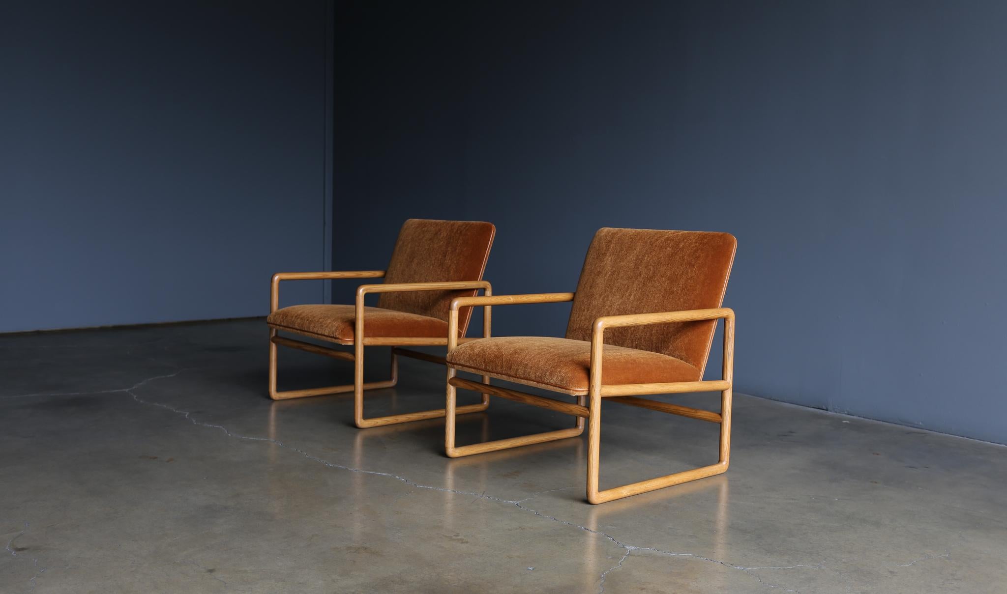 Ward Bennett Model 1226 oak & mohair lounge chairs for Brickel Associates, circa 1960. Cinnamon mohair upholstery with caramel leather piping. Restored solid oak frames.