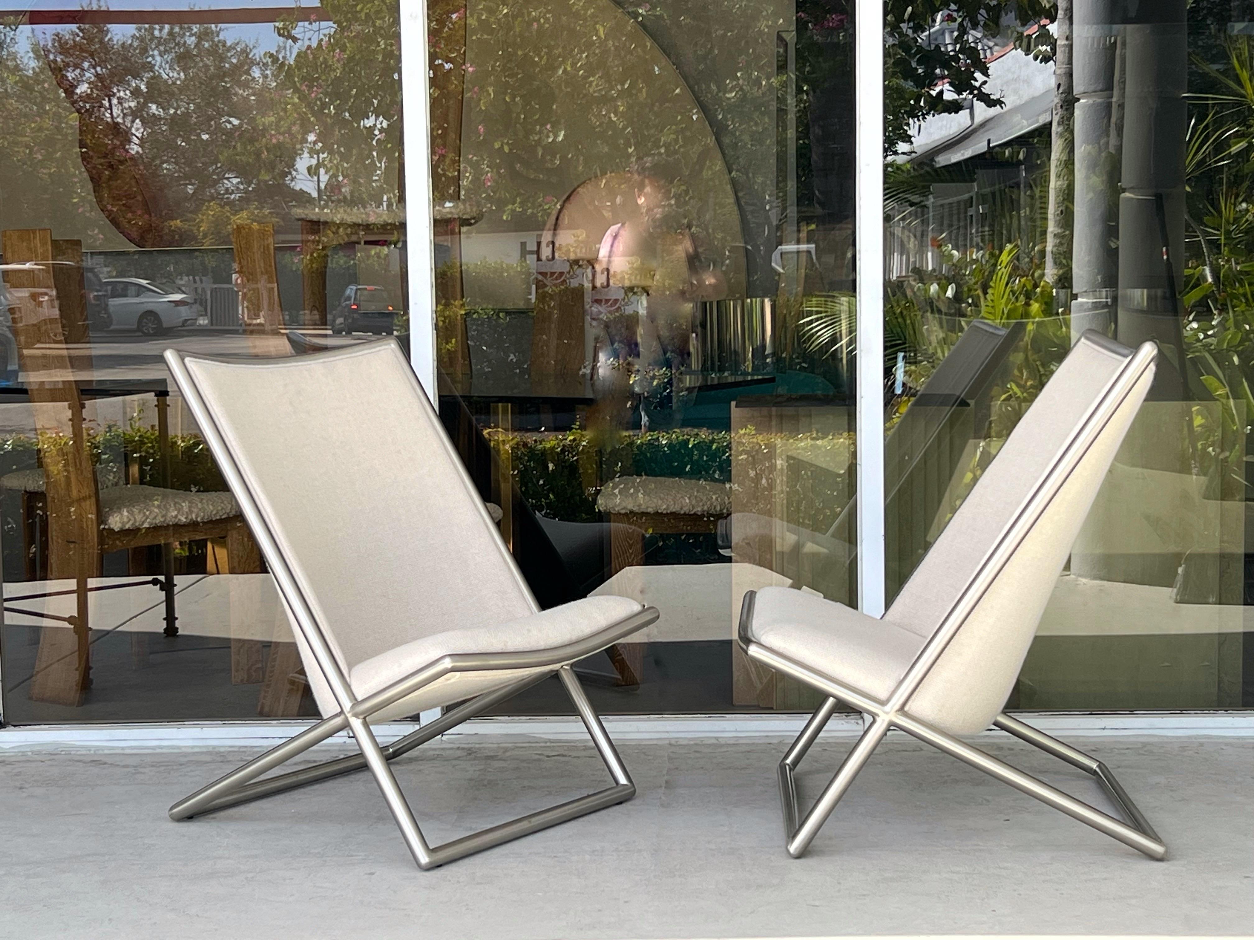 A pair iconic scissor chairs by Ward Bennet. Satin Steel frames with wool upholstery. 2 pairs available. 