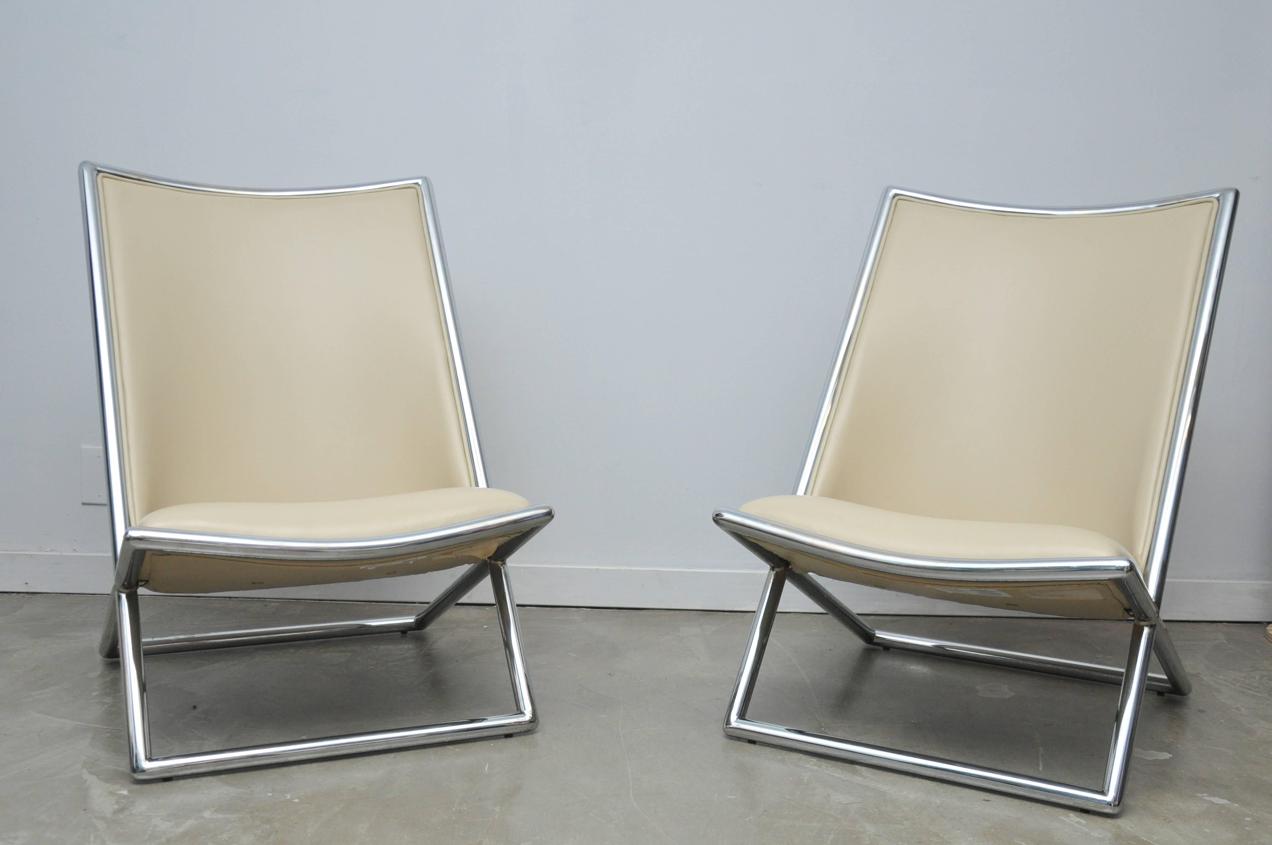 Chrome frame scissor chairs by Ward Bennett with white leather.