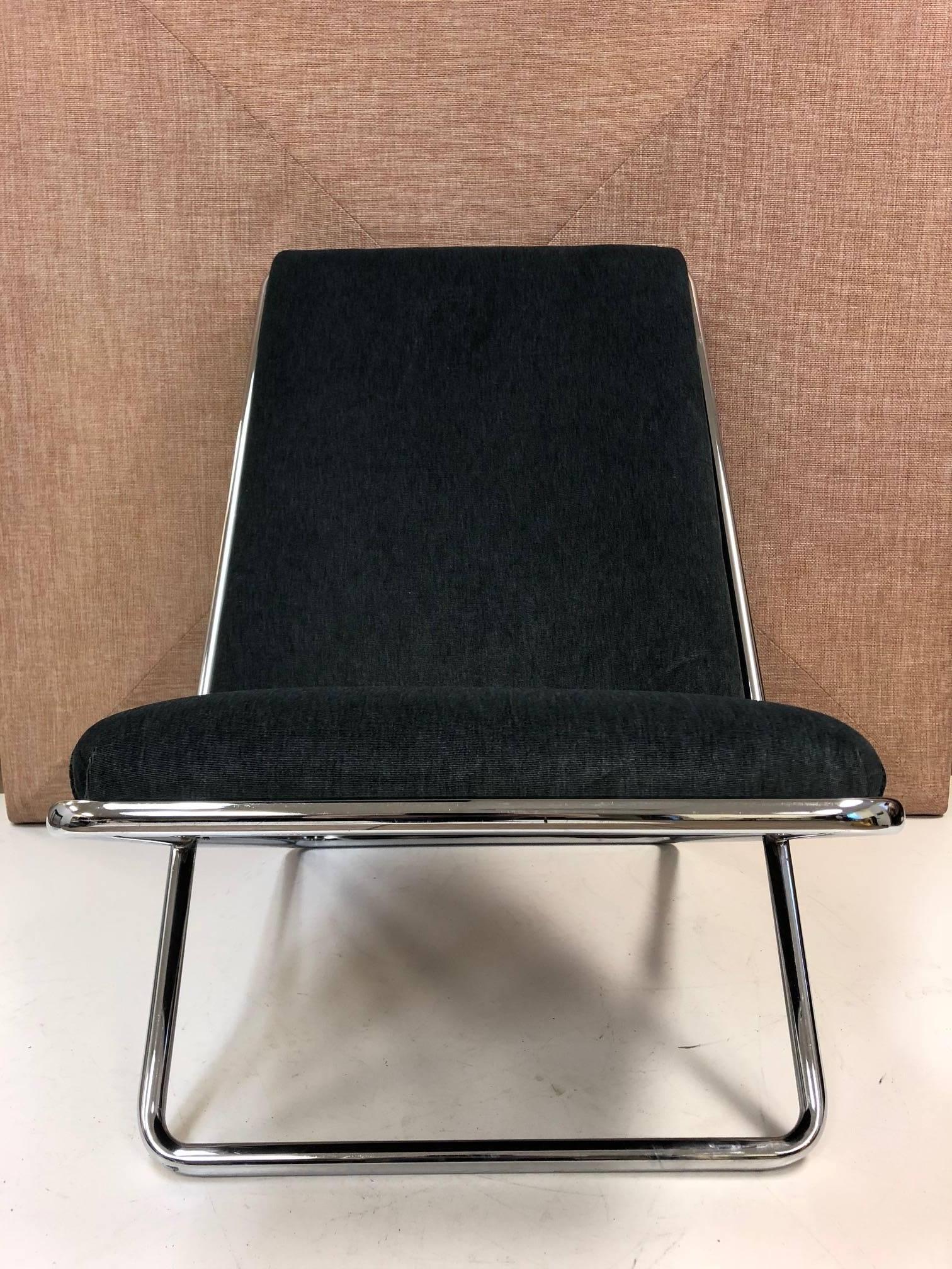 Ward Bennett scissor lounge chair. Has a tubular chrome frame with bluish velvet upholstery.