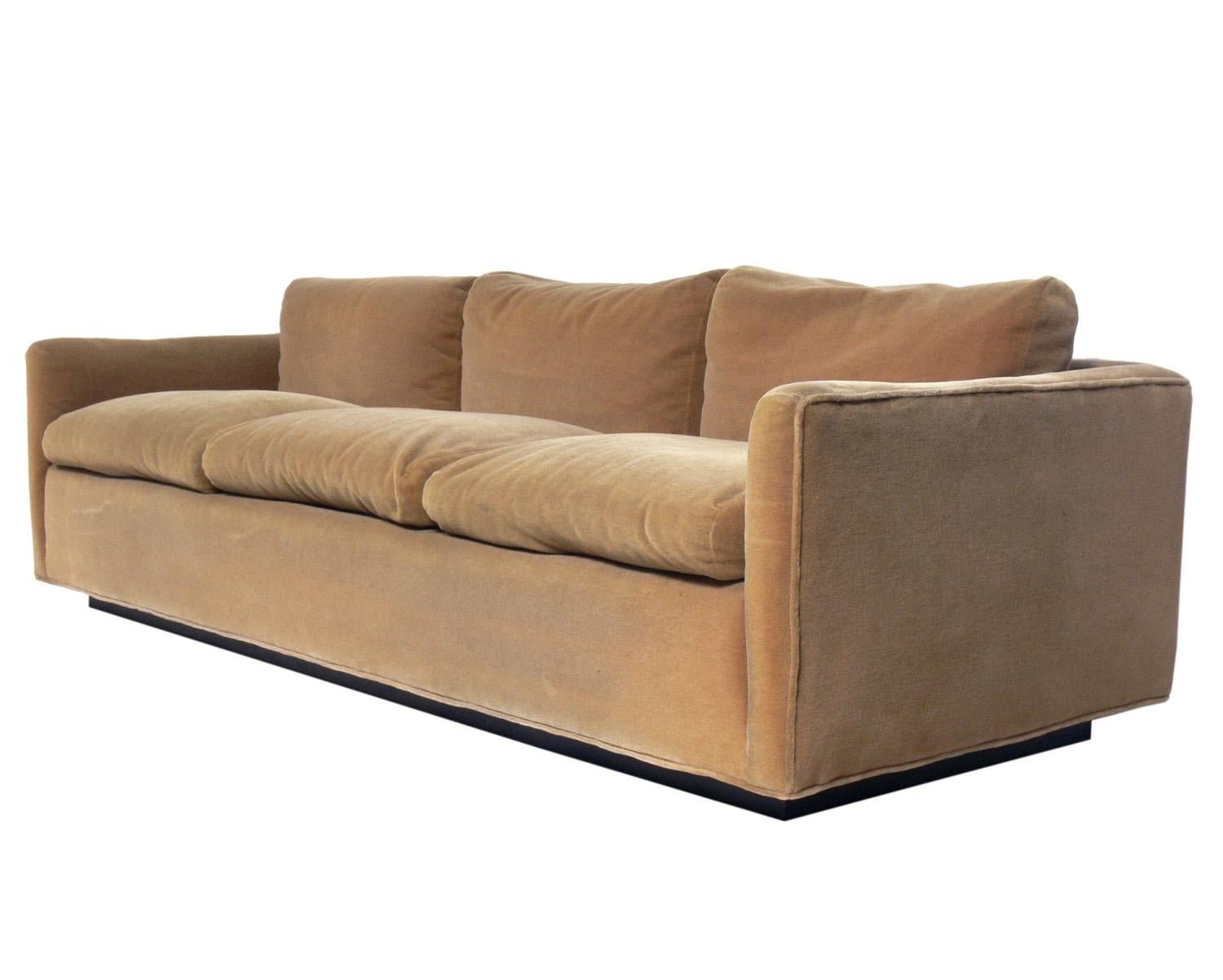 Clean lined sofa, designed by Ward Bennett for Lehigh Leopold, American, circa 1960s. Signed with Lehigh Leopold label on decking. This sofa currently retains it's original tan mohair upholstery. It exhibits some wear and should only be used if you
