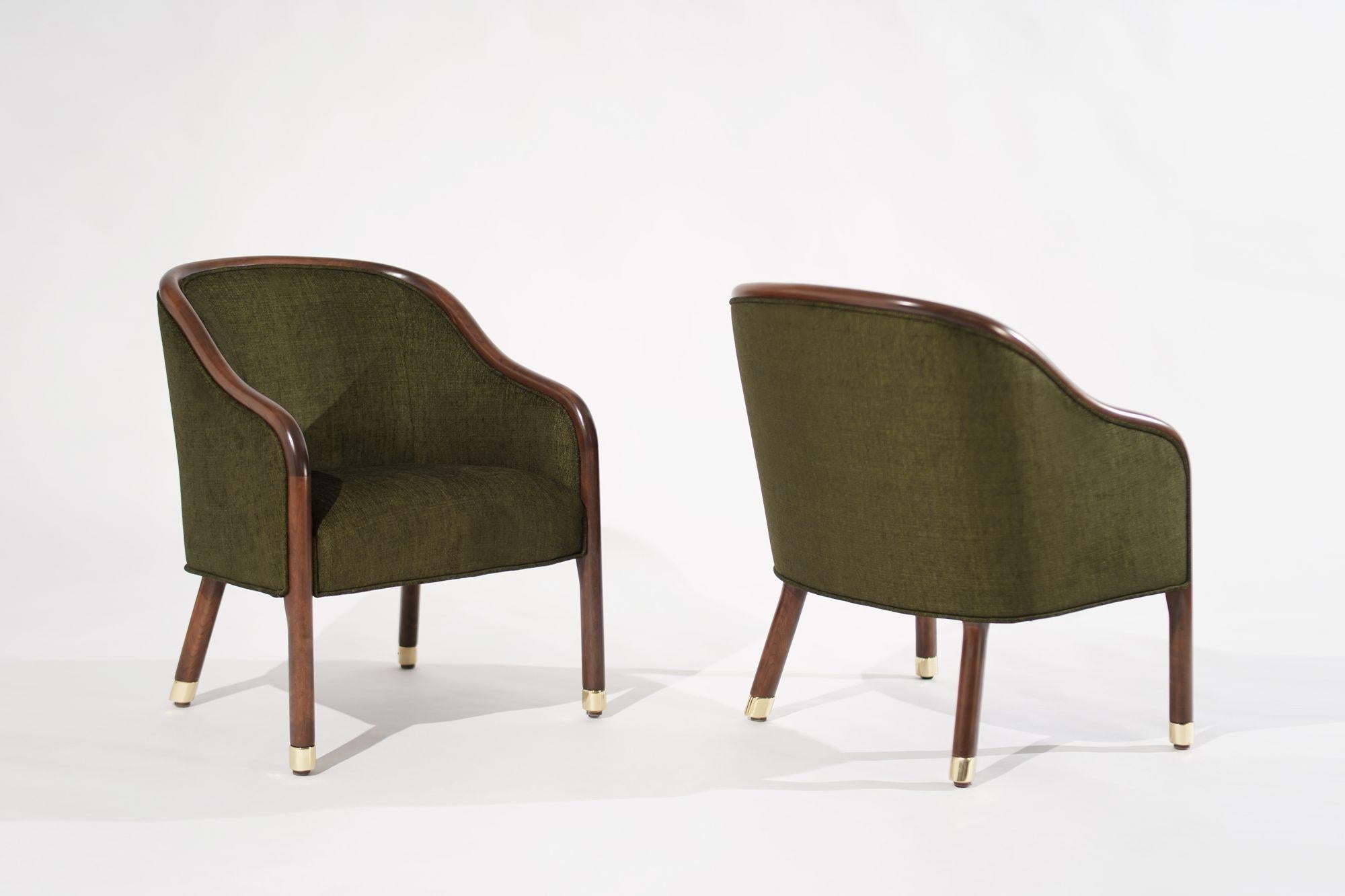 Vintage Ward Bennett Lounge Chairs, a true embodiment of 1970s design gracefully restored by Stamford Modern. These chairs exude the timeless charm of the era with their exposed walnut frames and brass feet, beautifully enhancing any space with a