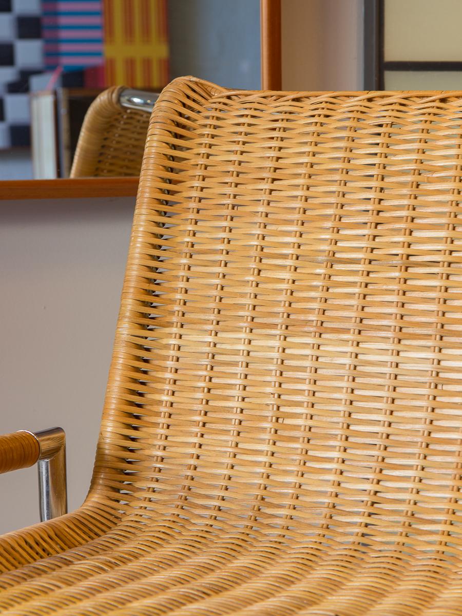 The Sled lounge chair designed by Ward Bennett for Brickel. An amazing 1960s accent chair. This wide chair design features woven cane seating and sleek tubular chromed steel. The X-shaped steel is welded to parallel rails like the familiar sled