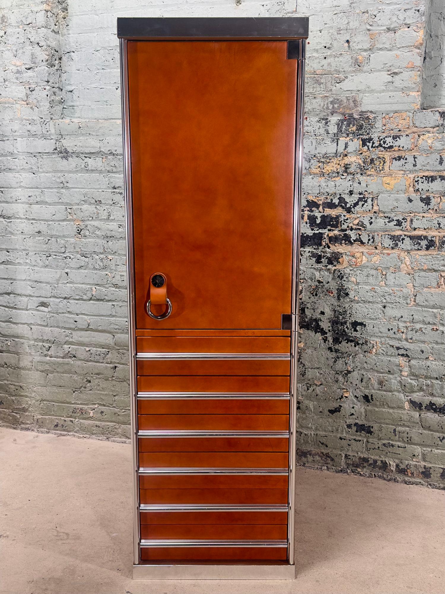 Wardrobe Cabinet/Bar by Guido Faleschini for Mariani/Pace, Italy 1970.
Cabinet has 6 drawers with a light in upper cabinet, with switch on top of cabinet for the light. There is a hanging rod plus pins for shelves (which we do not have) but could be
