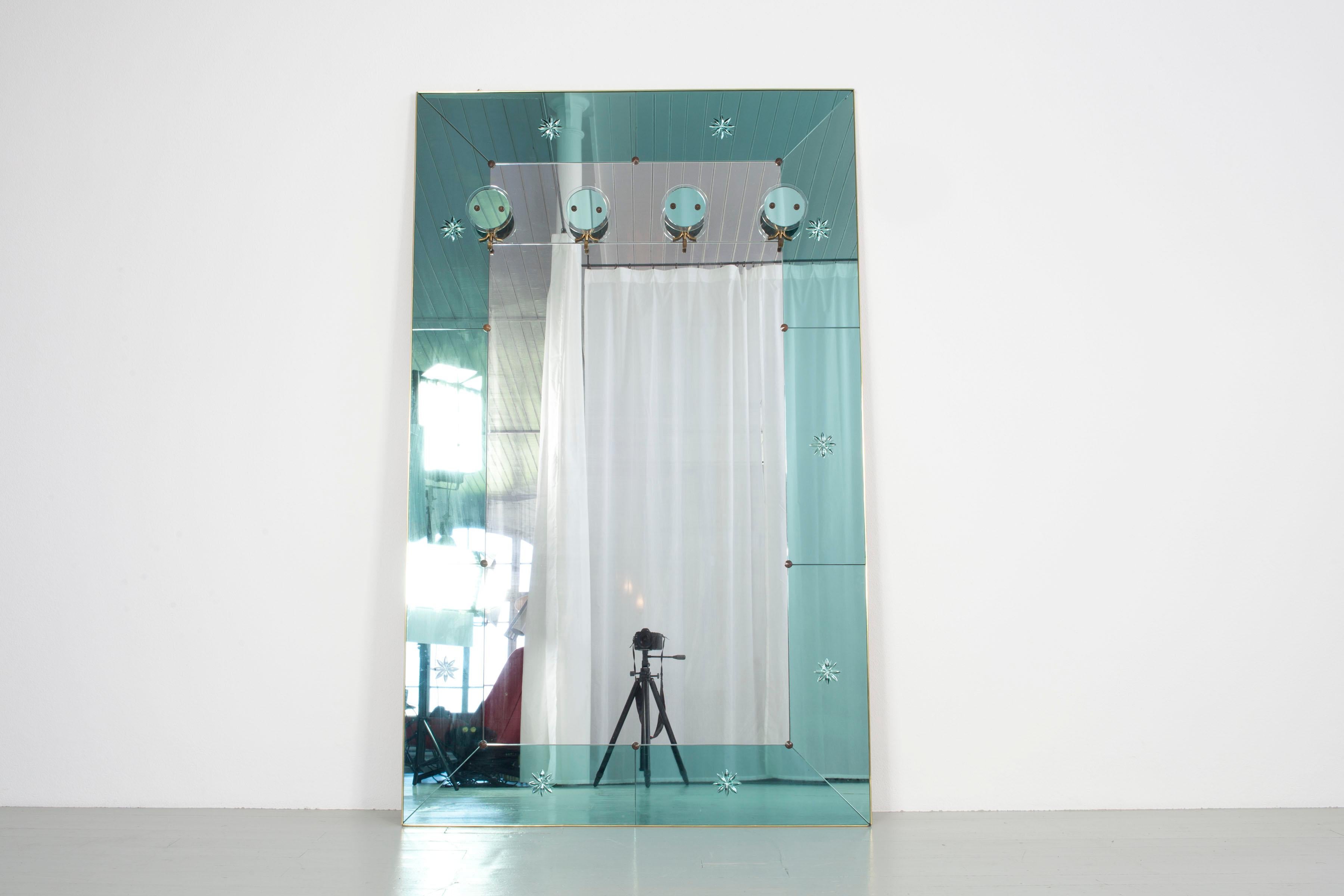 Big, extravagant wardrobe with original old turquoise-colored mirrors and hooks made of glass from Italy, 1950. The wardrobe is made of a mirror, framed by turquoise-colored glass, which is decorated with starlike engravings. The hooks are made of