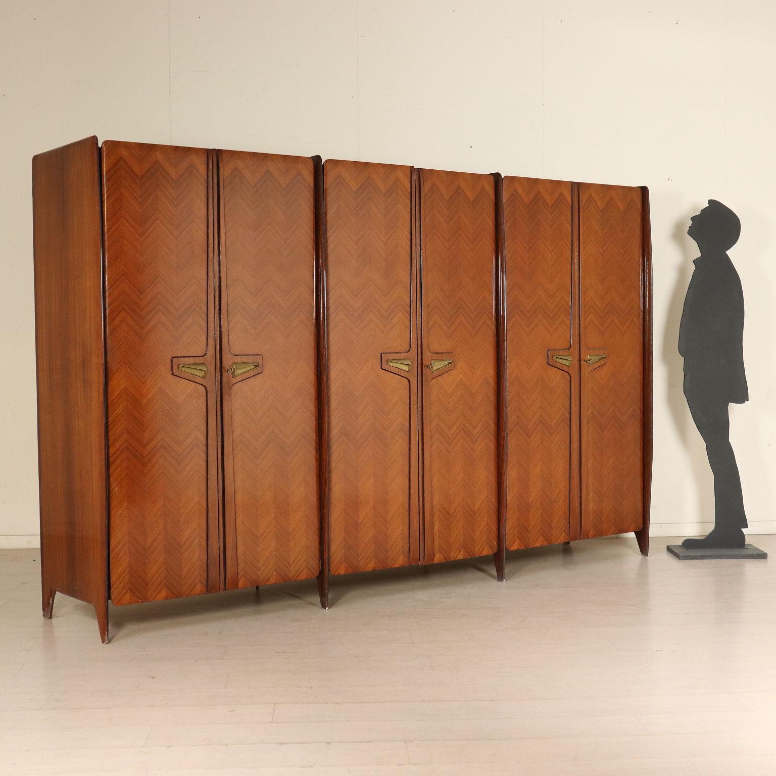A wardrobe, wood, brass handles. Manufactured in Italy, 1950s-1960s.