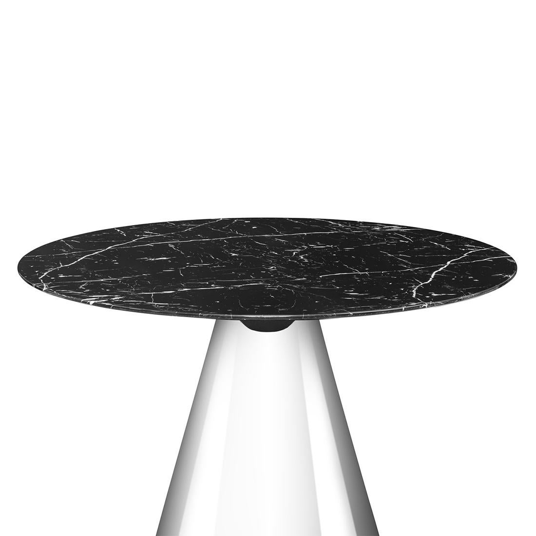 Round table Talia with round black
marble top on polished metal base.