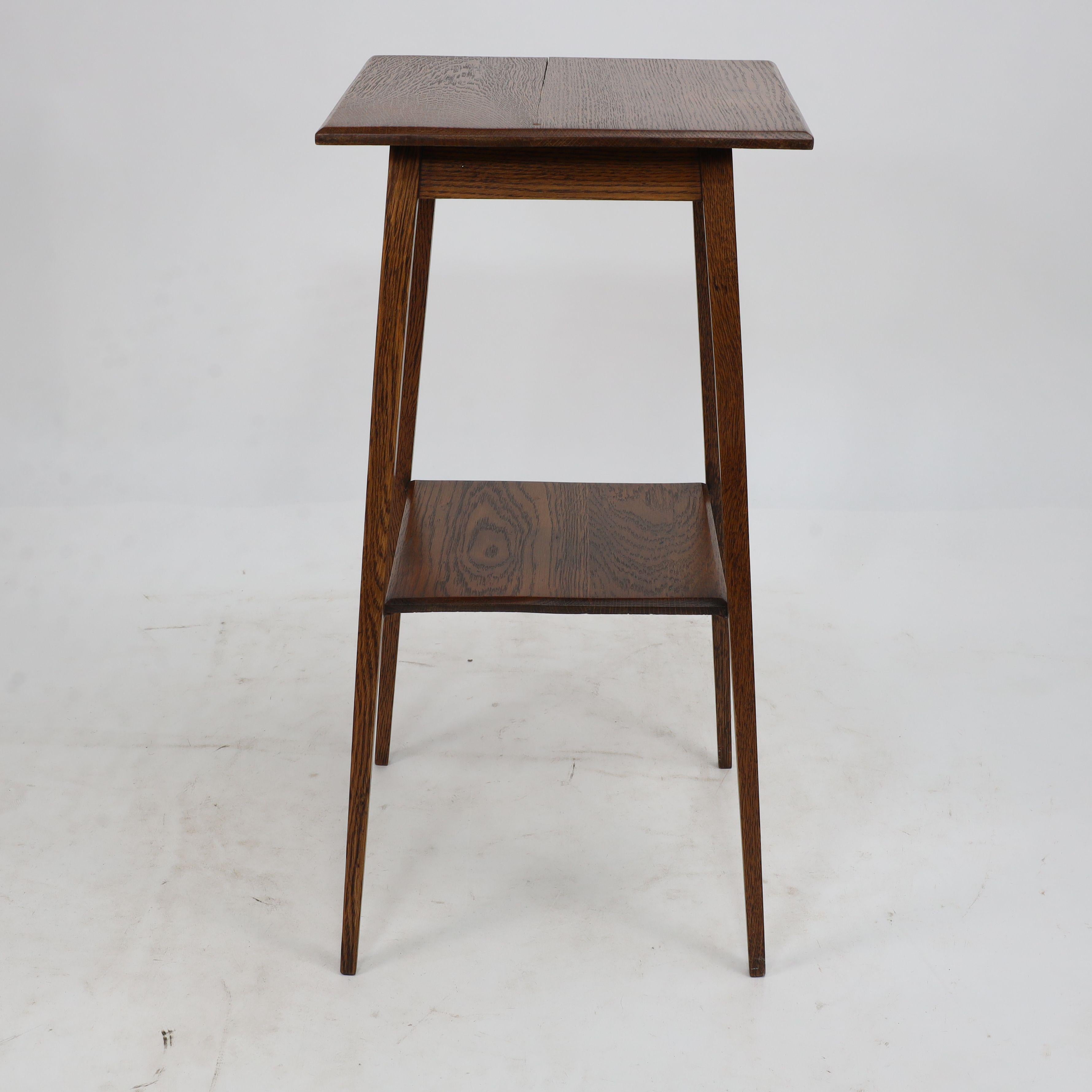 Early 20th Century Waring and Gillow. A good quality little Arts and Crafts oak sidetable For Sale