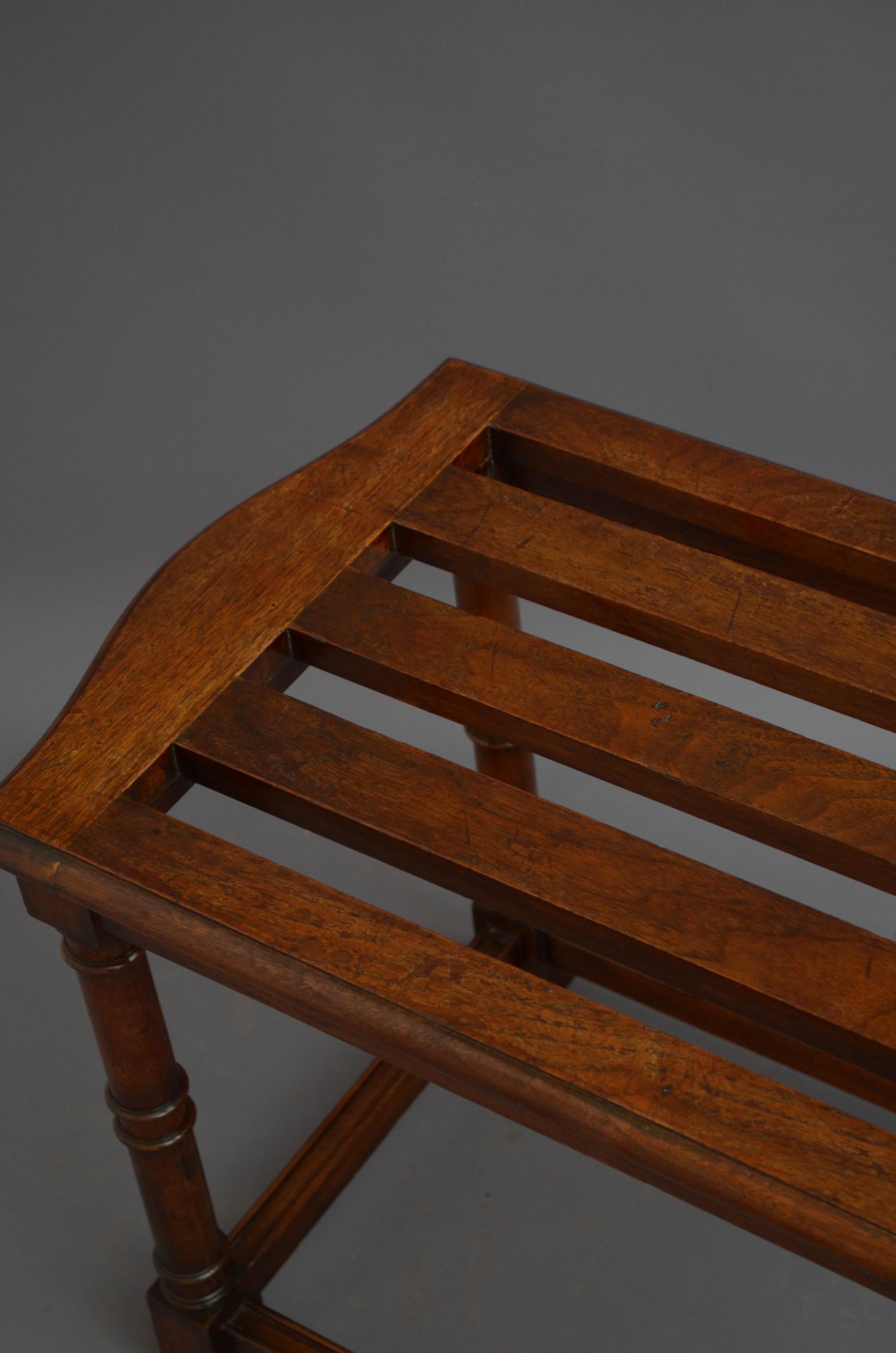 J06 Waring and Gillow walnut luggage rack with shaped top and turned and ring legs united by stretchers. This antique luggage rack would make a good hall bench. The rack retains its original finish, colour and patina and it is in home ready