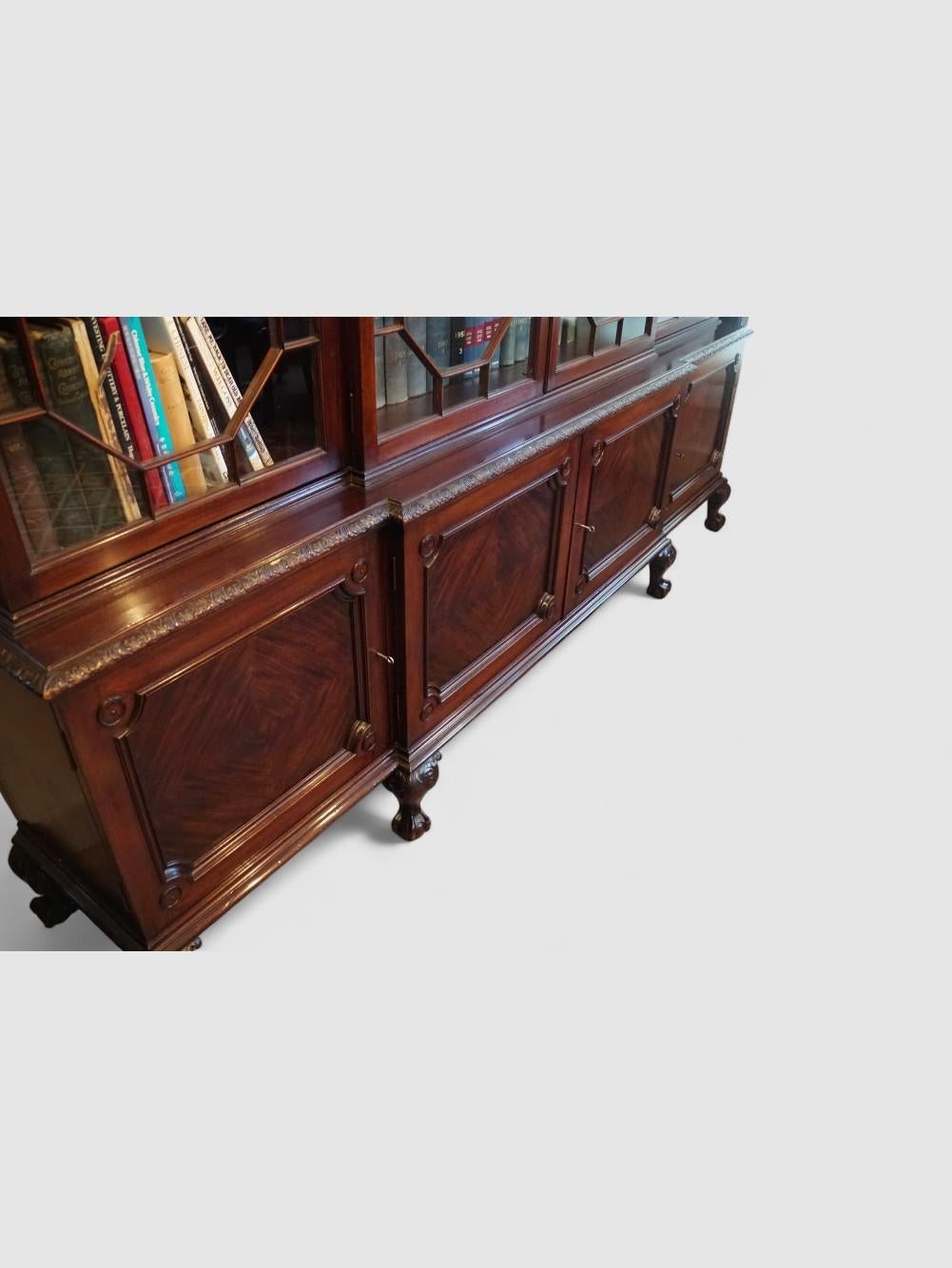 Waring and Gillows breakfront bookcase 
This Waring and Gillows breakfront bookcase was made circa 1910.
The break fronted bookcase is made in fine mahogany and made in 3 sections; this allows for easy transportation to your home.
The top section