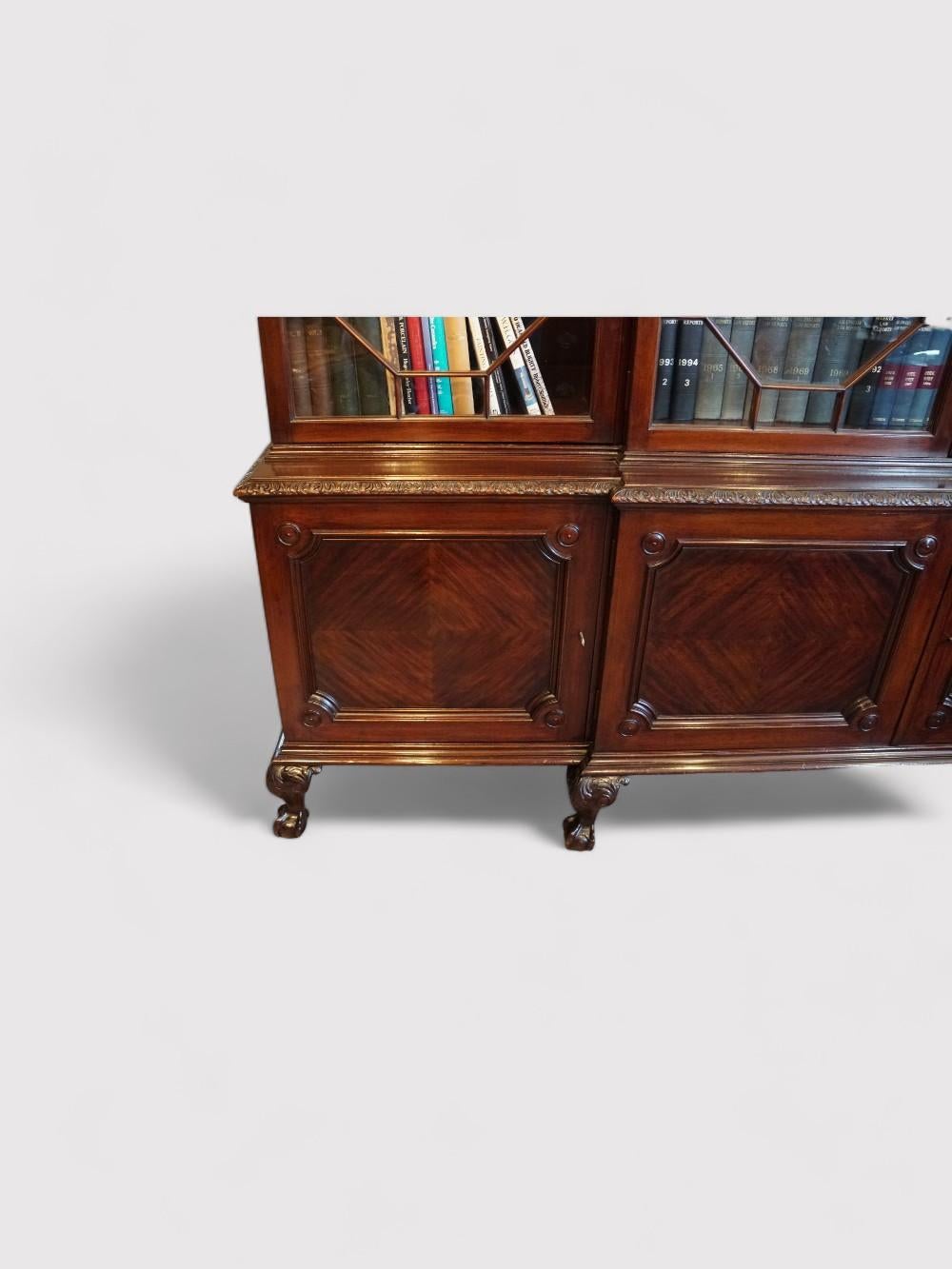 English Waring and Gillows breakfront bookcase  For Sale