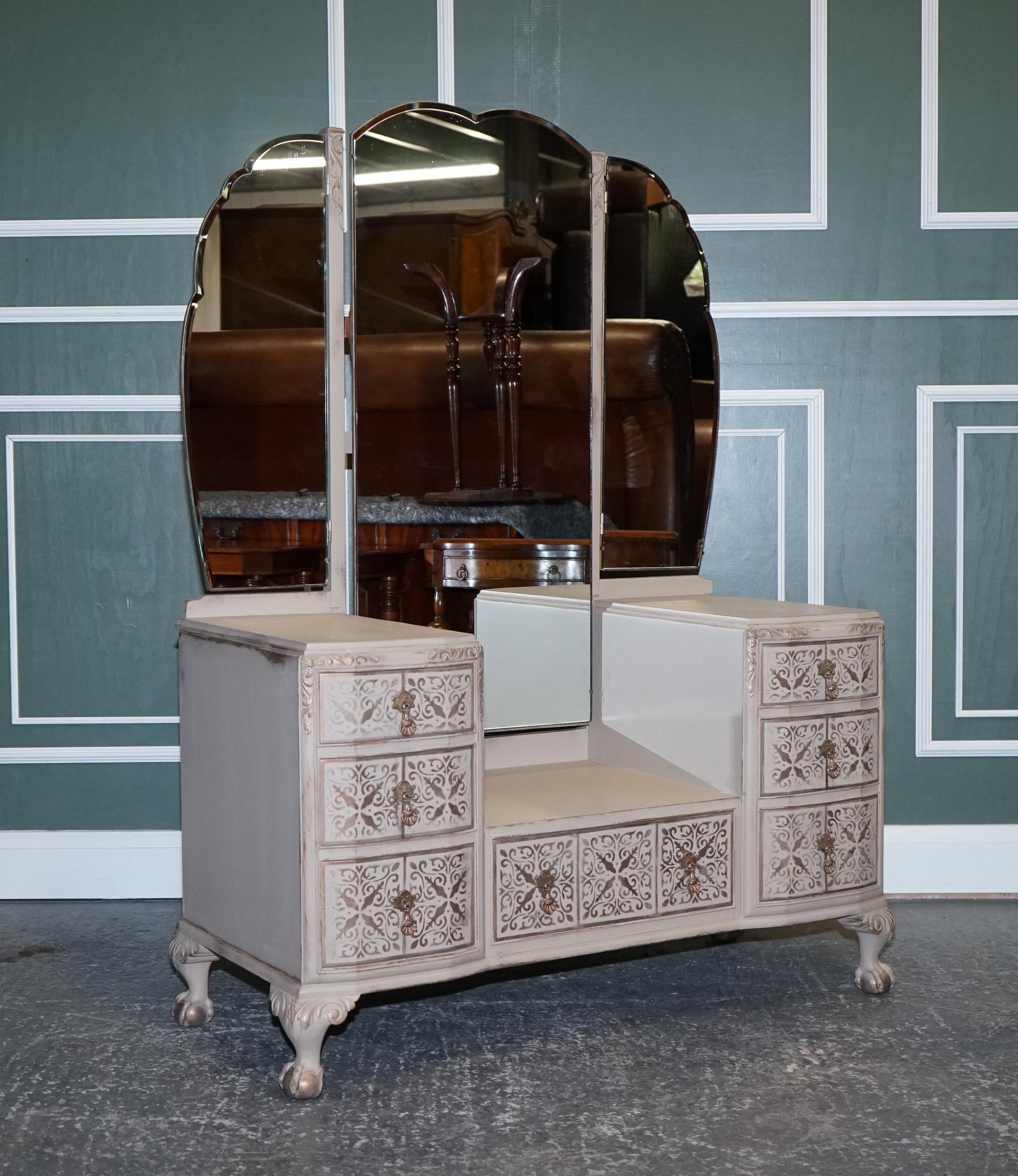 We are delighted to offer for sale this Waring & Gillow 1932 Antiqued Hand Painted Dressing Table.

An antiqued hand-painted dressing table with designs on the drawers is a stunning piece of furniture that is sure to elevate any bedroom. 

This