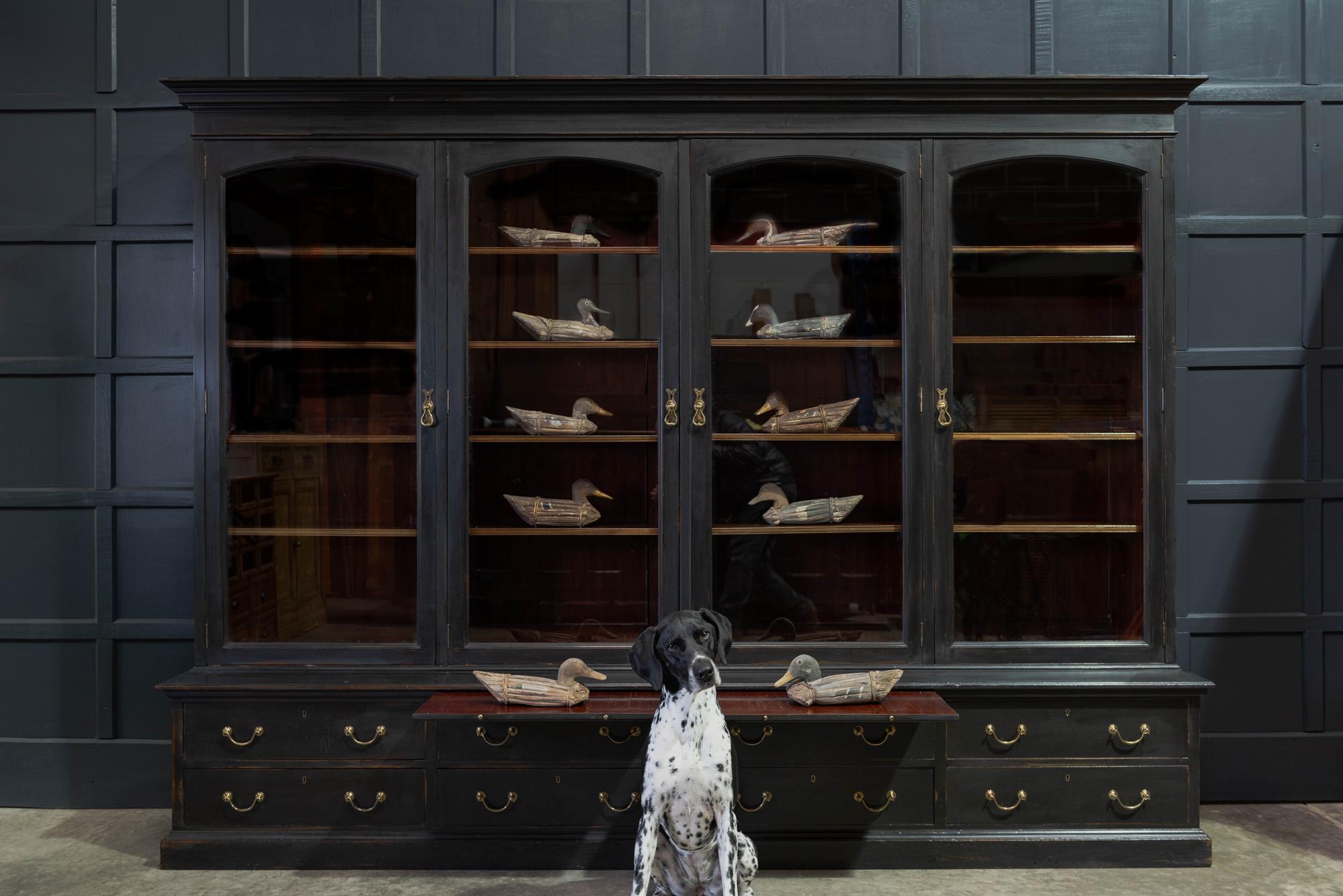 Waring & Gillows glazed ebonised mahogany bookcase
circa 1897-1903.

Superb quality Waring & Gillows 4 door glazed ebonised bookcase - Stamped ‘Warings Oxford st London W’. Solid mahogany with original heavy hand blown glass glazed doors, 1 master