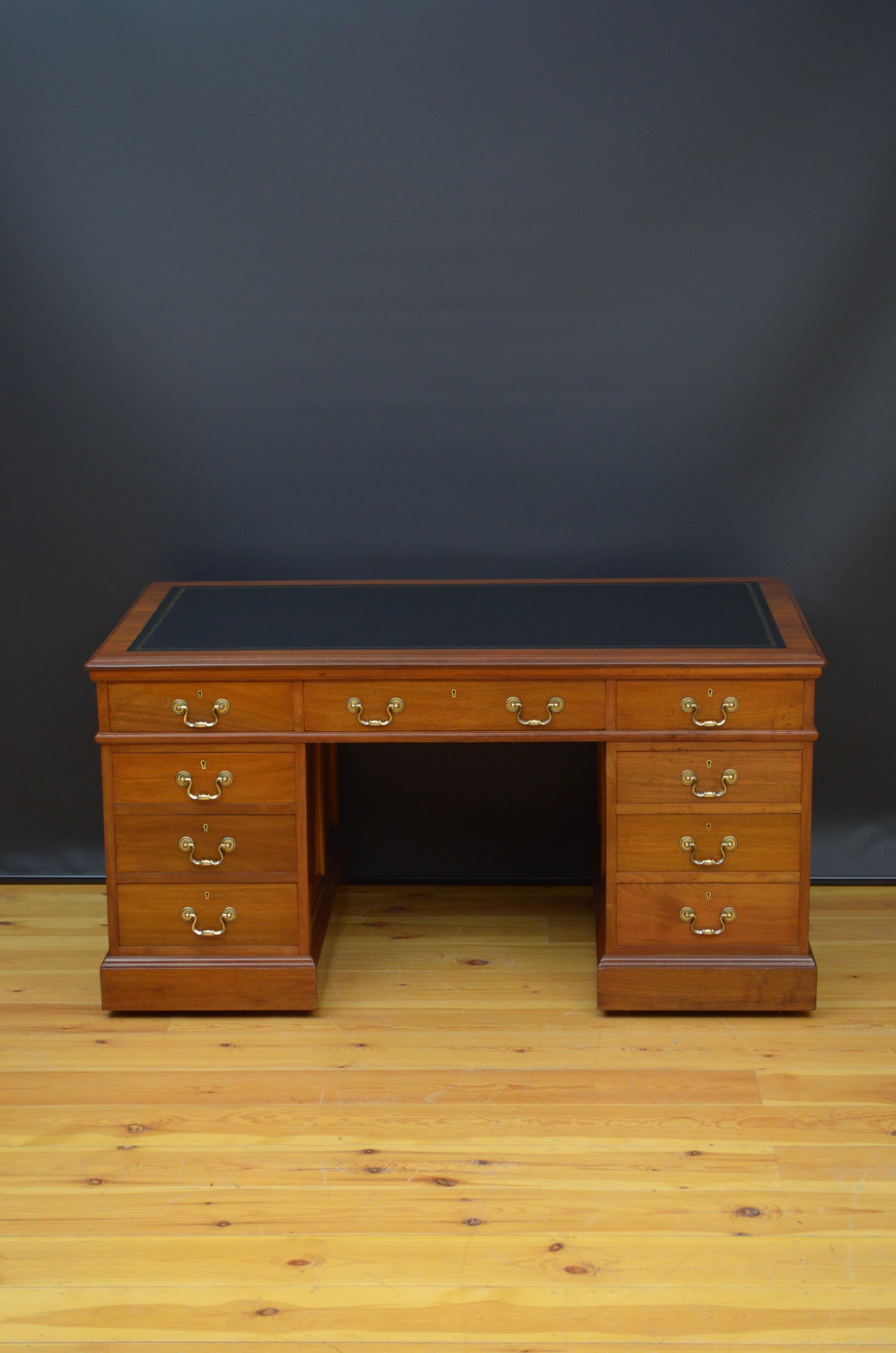Sn5210 fine quality Edwardian figured walnut desk with fielded panelled sides, having new black tooled leather writing surface and three frieze drawers above further three mahogany lined, graduated drawers to each pedestal and panelled cupboards