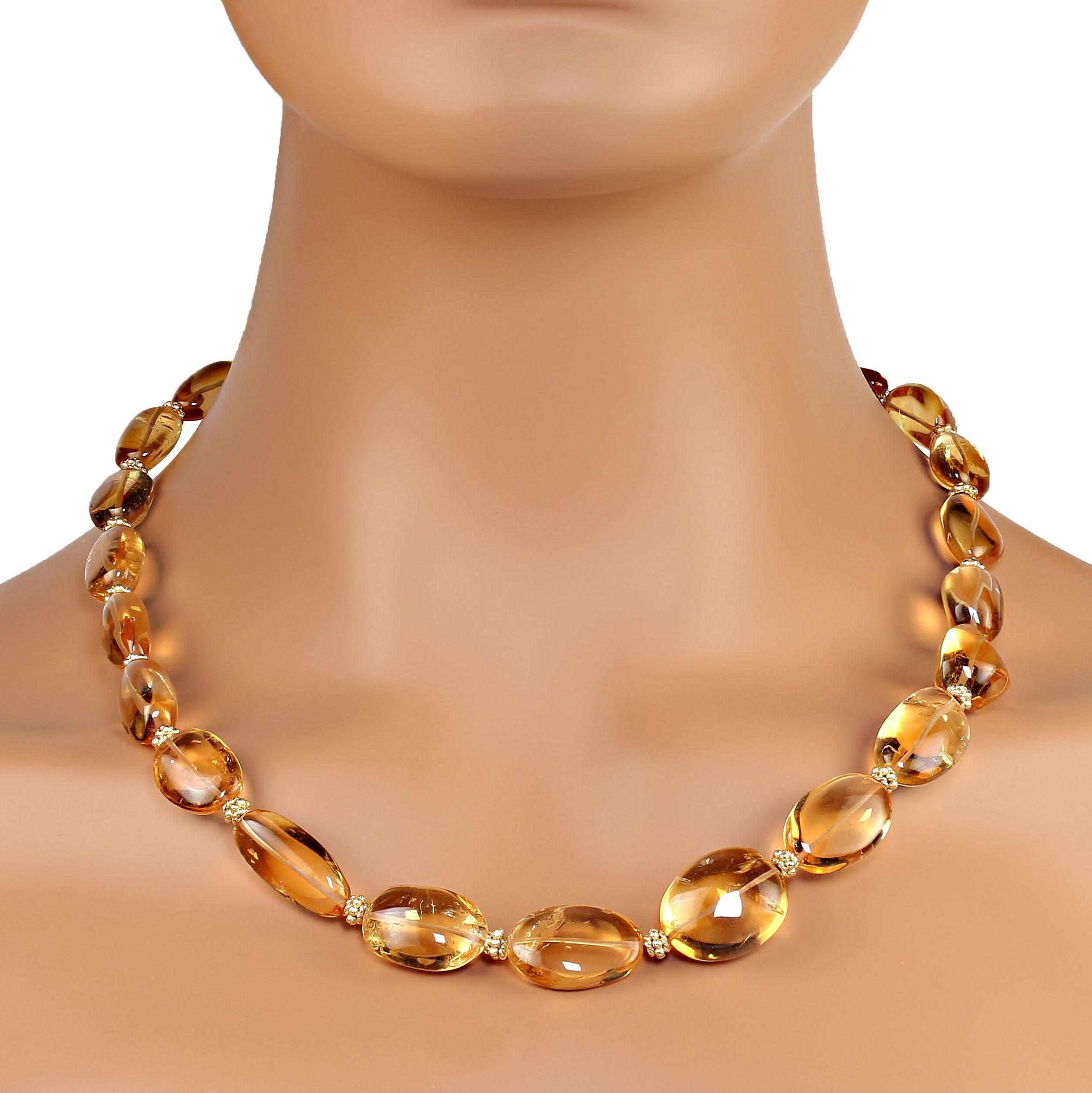 This lovely 21 inch citrine necklace is slightly graduated, 18-22 mm.  The smooth, highly polished nuggets are basically ovals and secured with a 14k vermeil hook and eye clasp.  The citrines total carat weight is 369ct.   MN2352