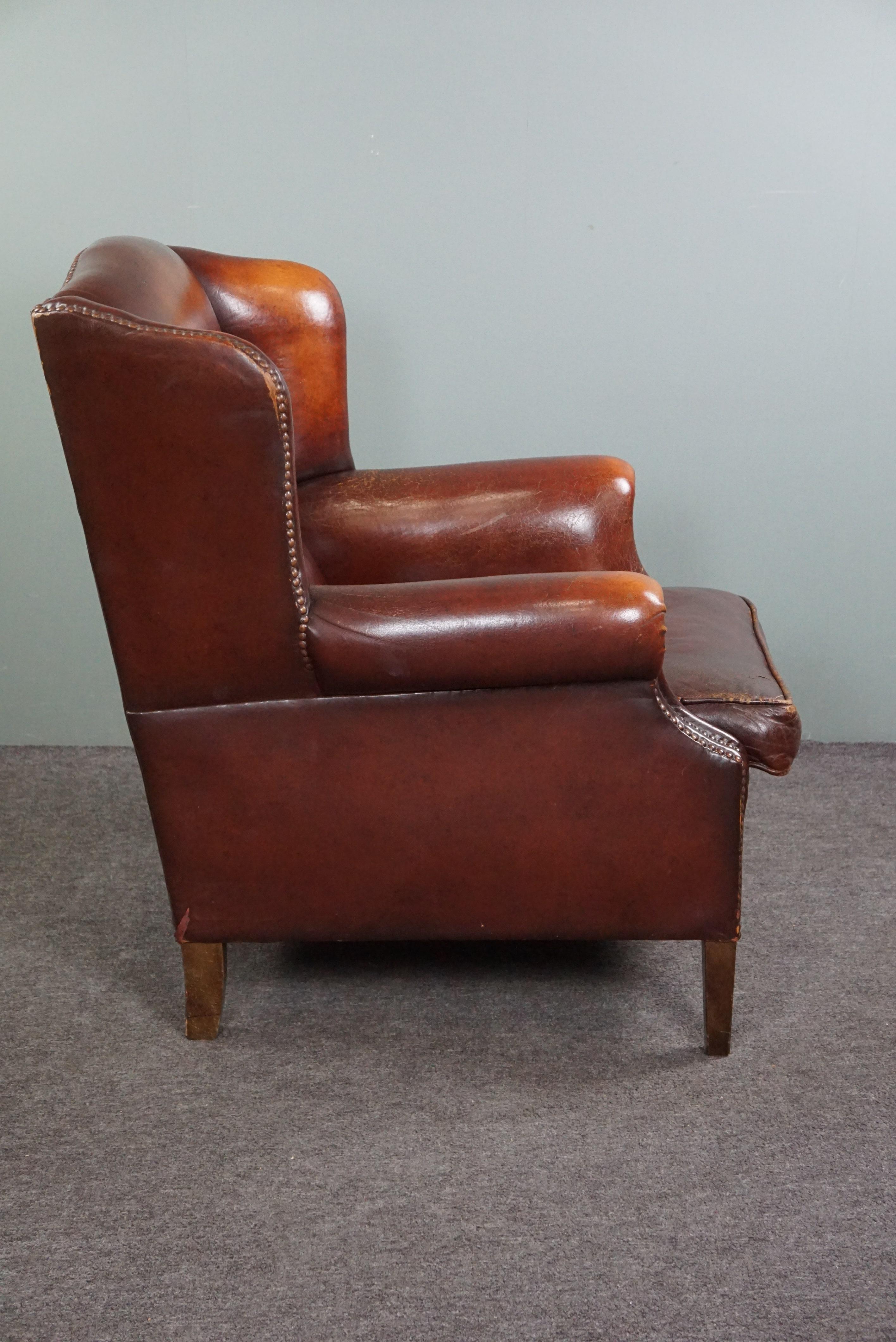 Dutch Warm brown sheep leather wing chair with character For Sale