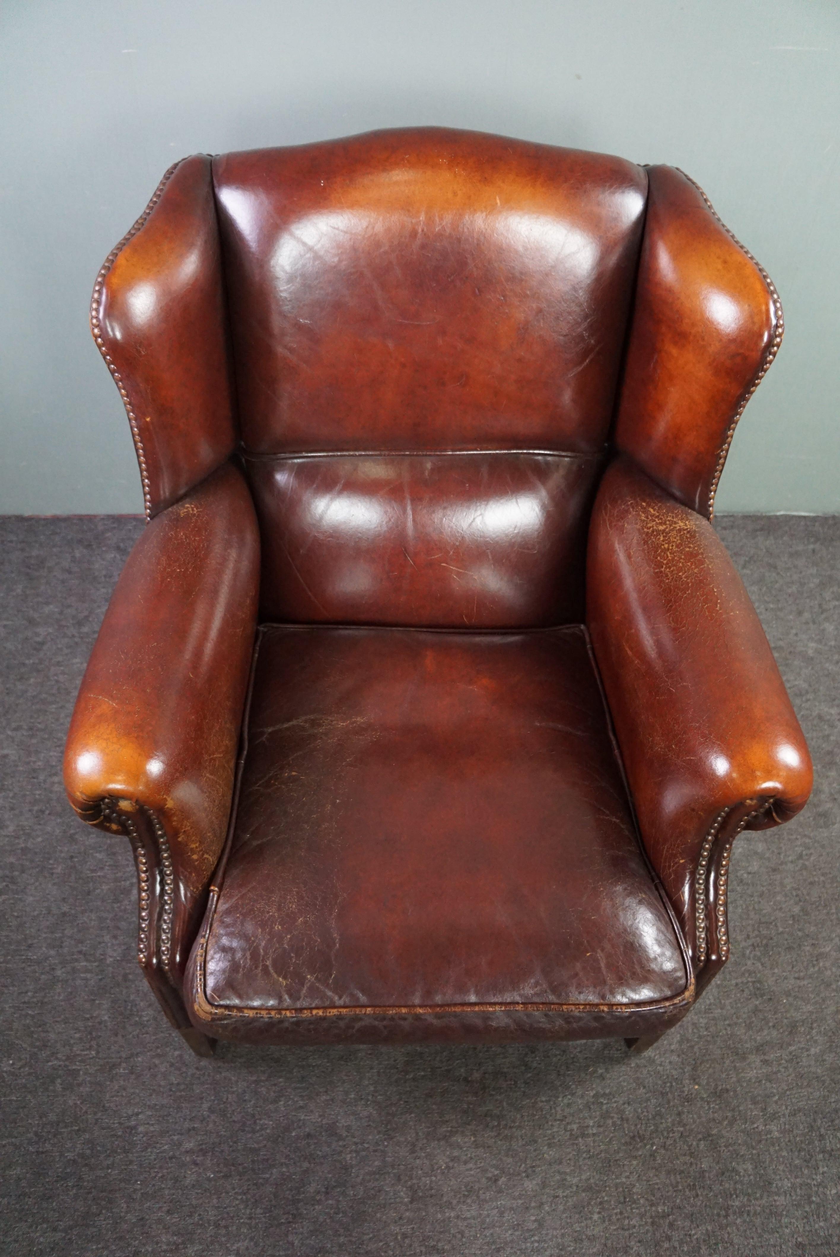 Contemporary Warm brown sheep leather wing chair with character For Sale