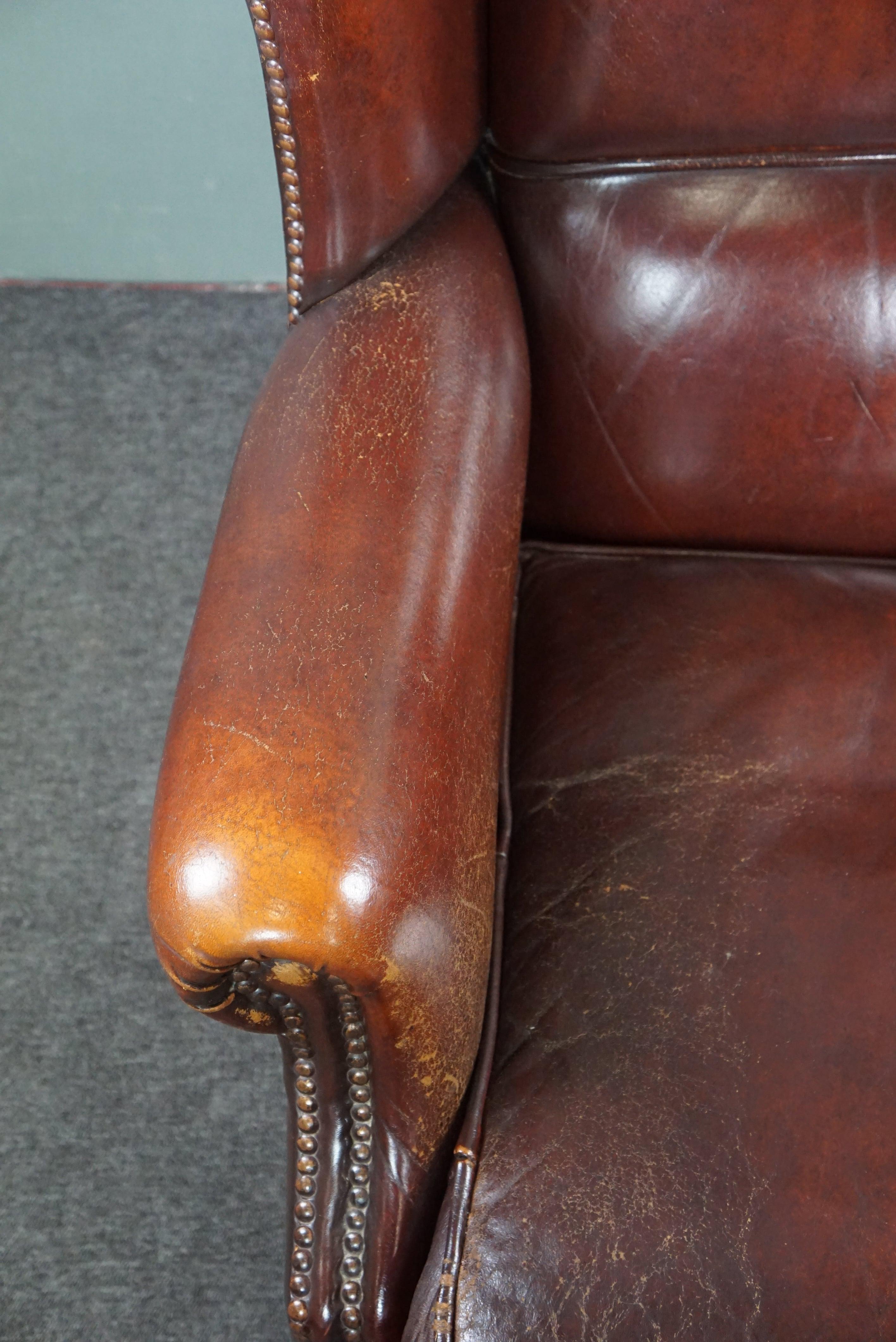 Leather Warm brown sheep leather wing chair with character For Sale