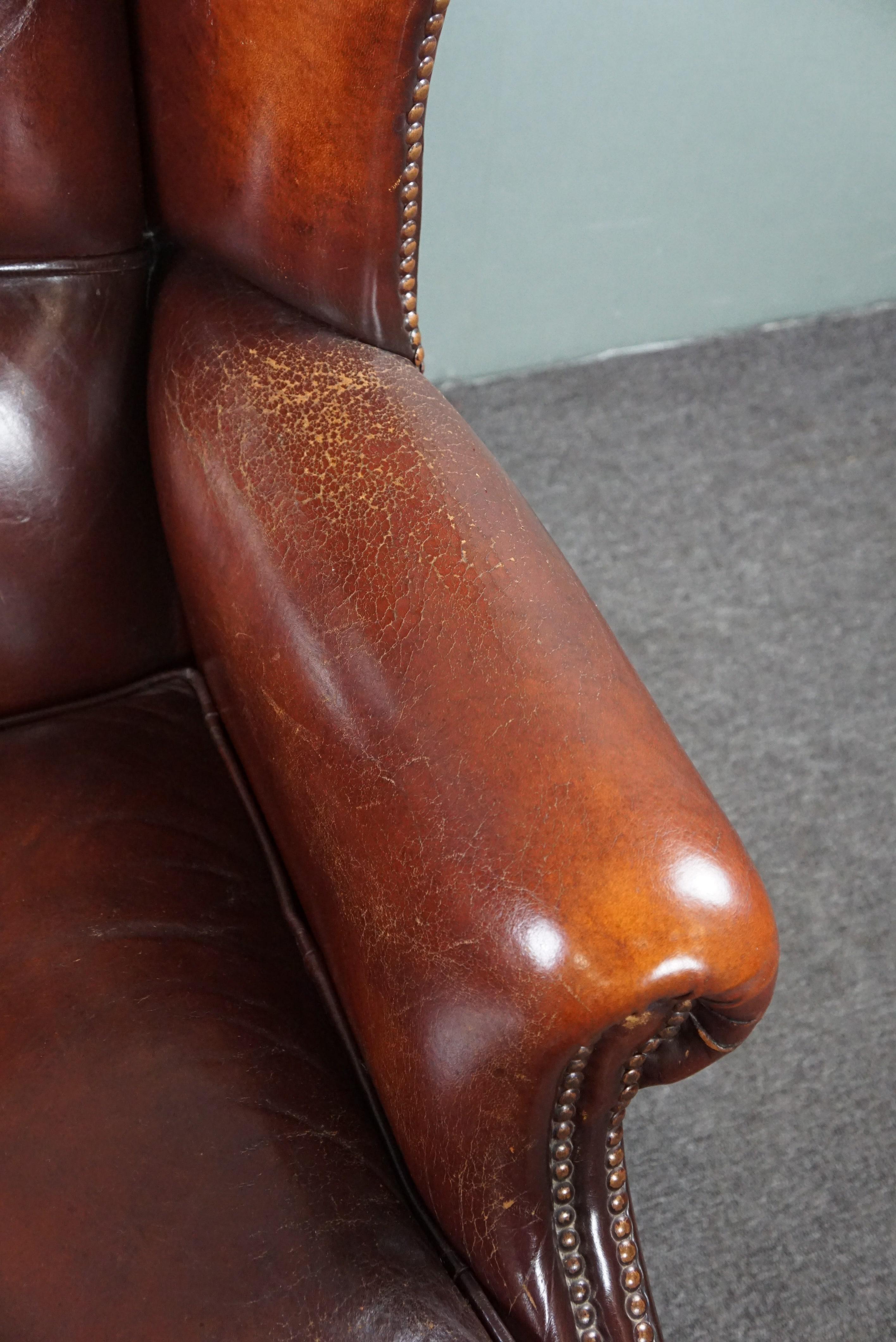 Warm brown sheep leather wing chair with character For Sale 1