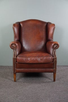 Warm-colored sheepskin leather armchair