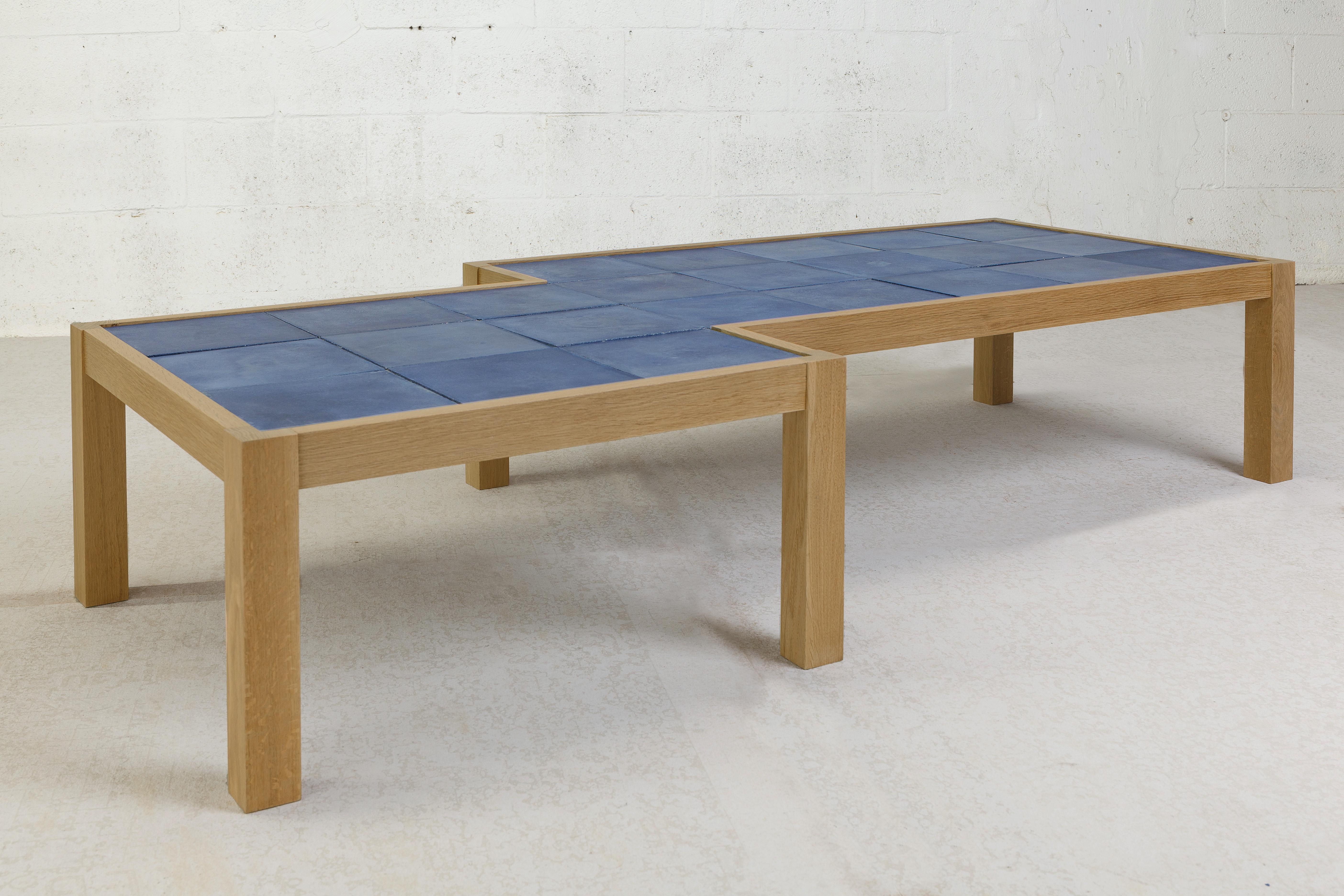 The new limited edition Blue Pixel Shift table is a warm contemporary design made of solid white oak and specialty blue hydraulic tiles. The frame and legs are made of solid white oak with a natural finish that adds warm tones and a sense of