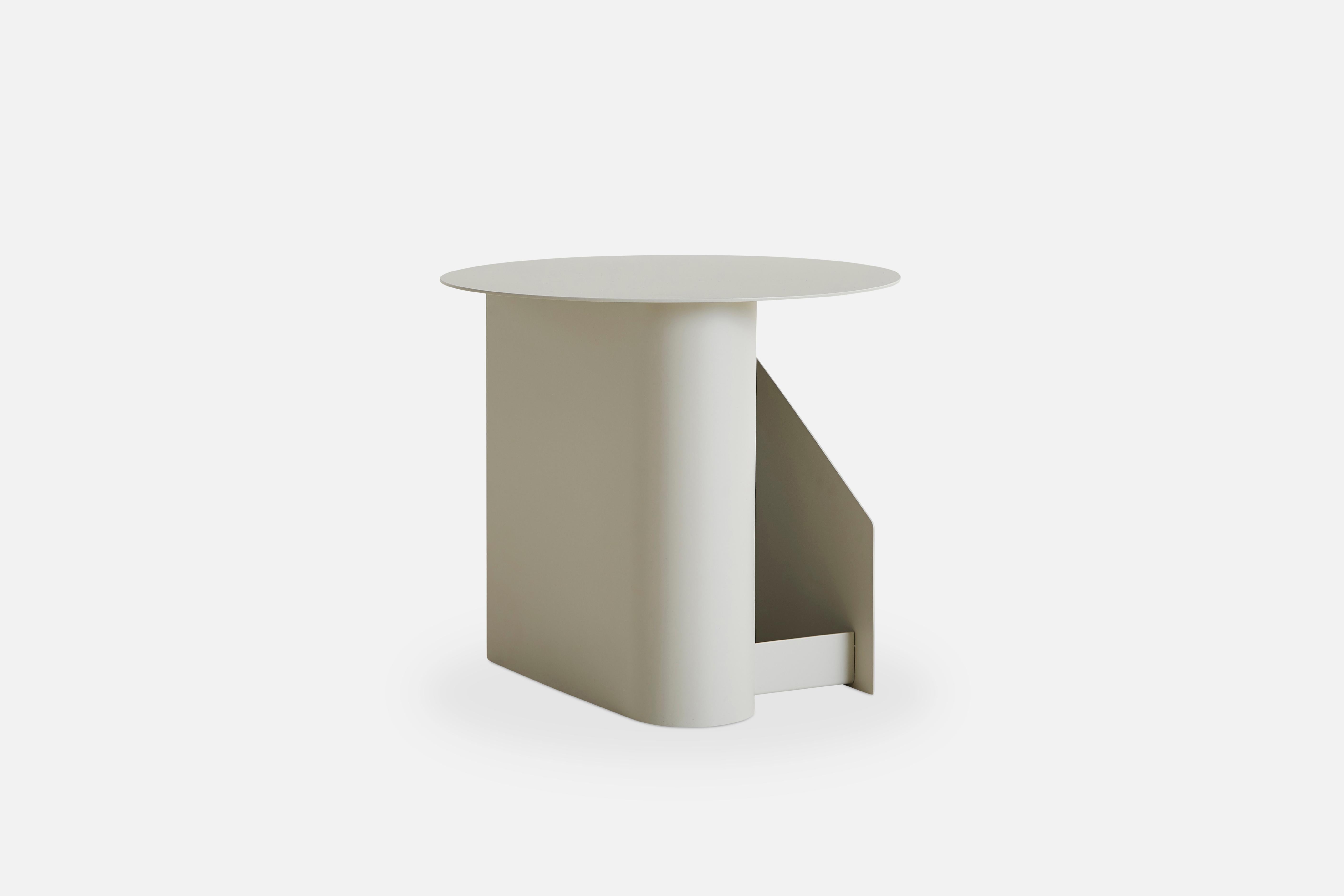 Warm Grey Sentrum side table by Schmahl +Schnippering
Materials: Metal
Dimensions: D 40 x W 40 x H 36 cm
Also available in different colours. 

The founders, Mia and Torben Koed, decided to put their 30 years of experience into a new project.