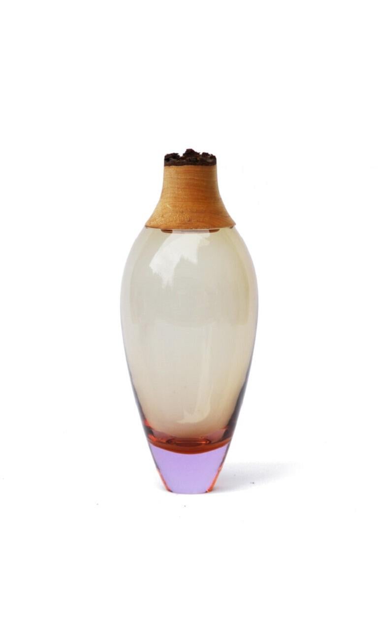 Warm Lavender Matisse stacking vessel I, Pia Wüstenberg
Dimensions: D 9 x H 23
Materials: glass, wood

The Matisse Stacking Vessels are treasures, small splashes of curvy glass with a wooden crown. The collection was originally designed for the