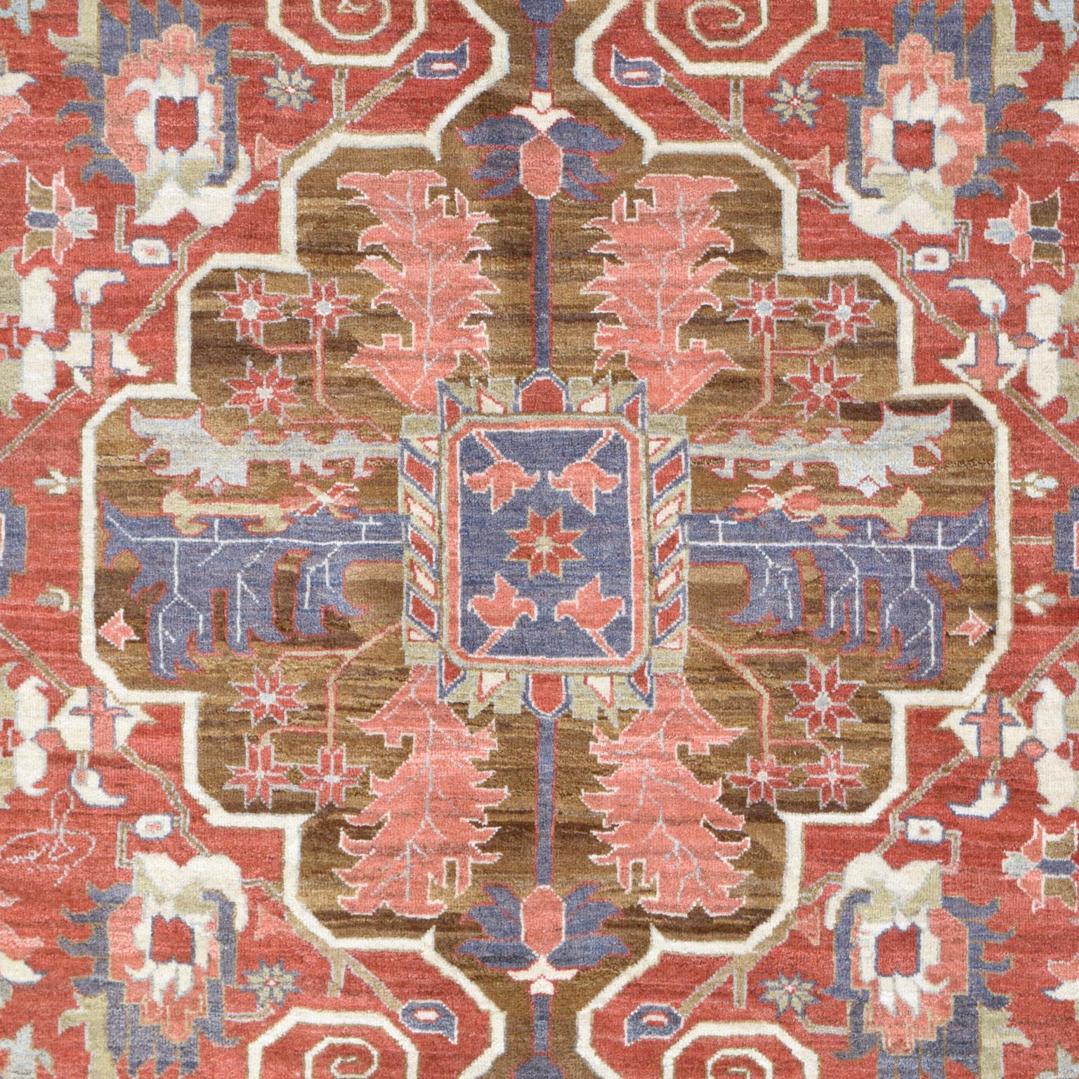 Detailed by organically dyed shades of red, purple, pink, light green, and brown wool, this hand-knotted Heriz carpet measures 8’5” x 10’10” and belongs to the Orley Shabahang Traditional Collection. The carpet’s composition illustrates a