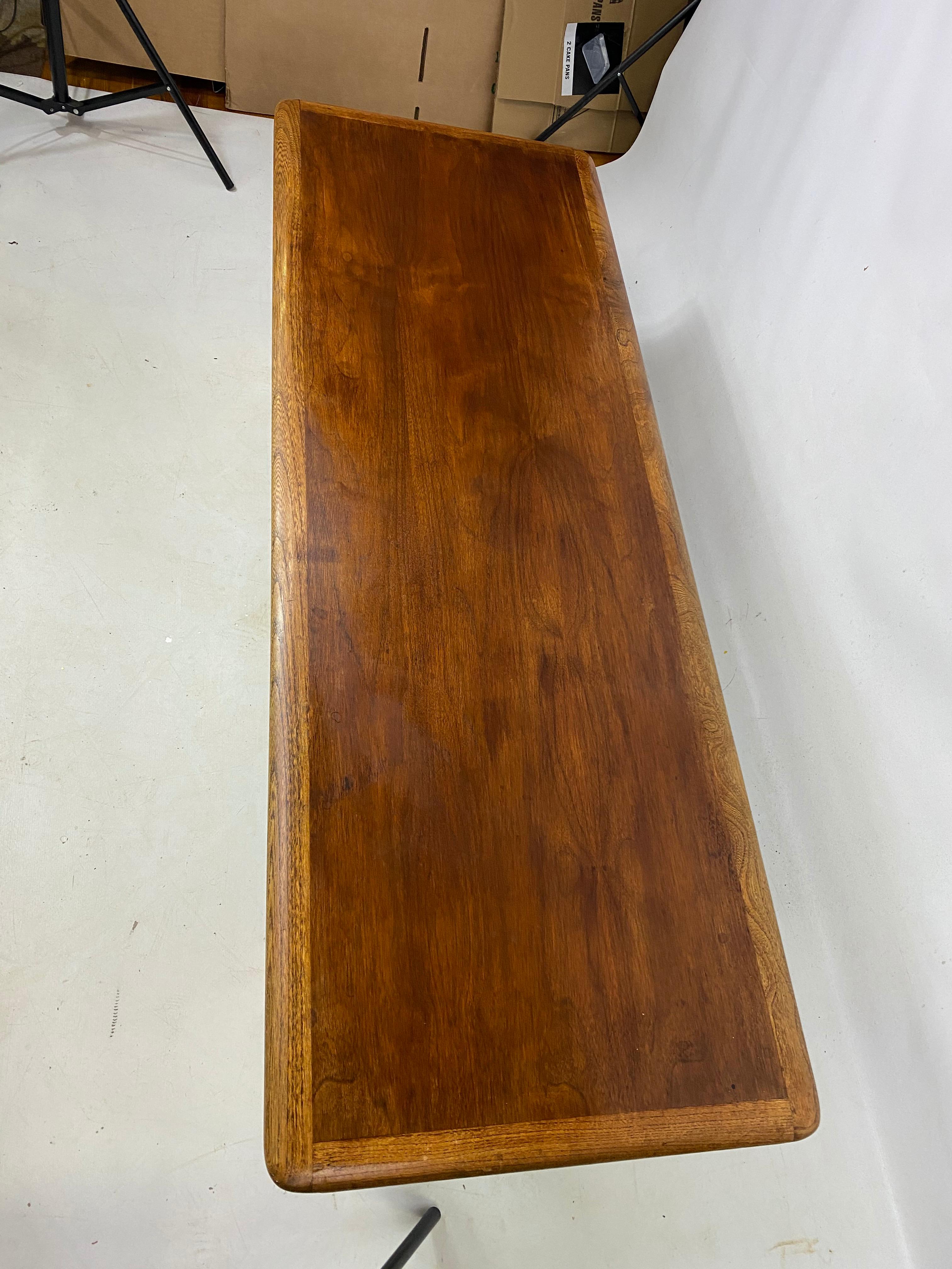 Warren church for Lane perception walnut coffee table. Table is very well made and has a great stylish design.