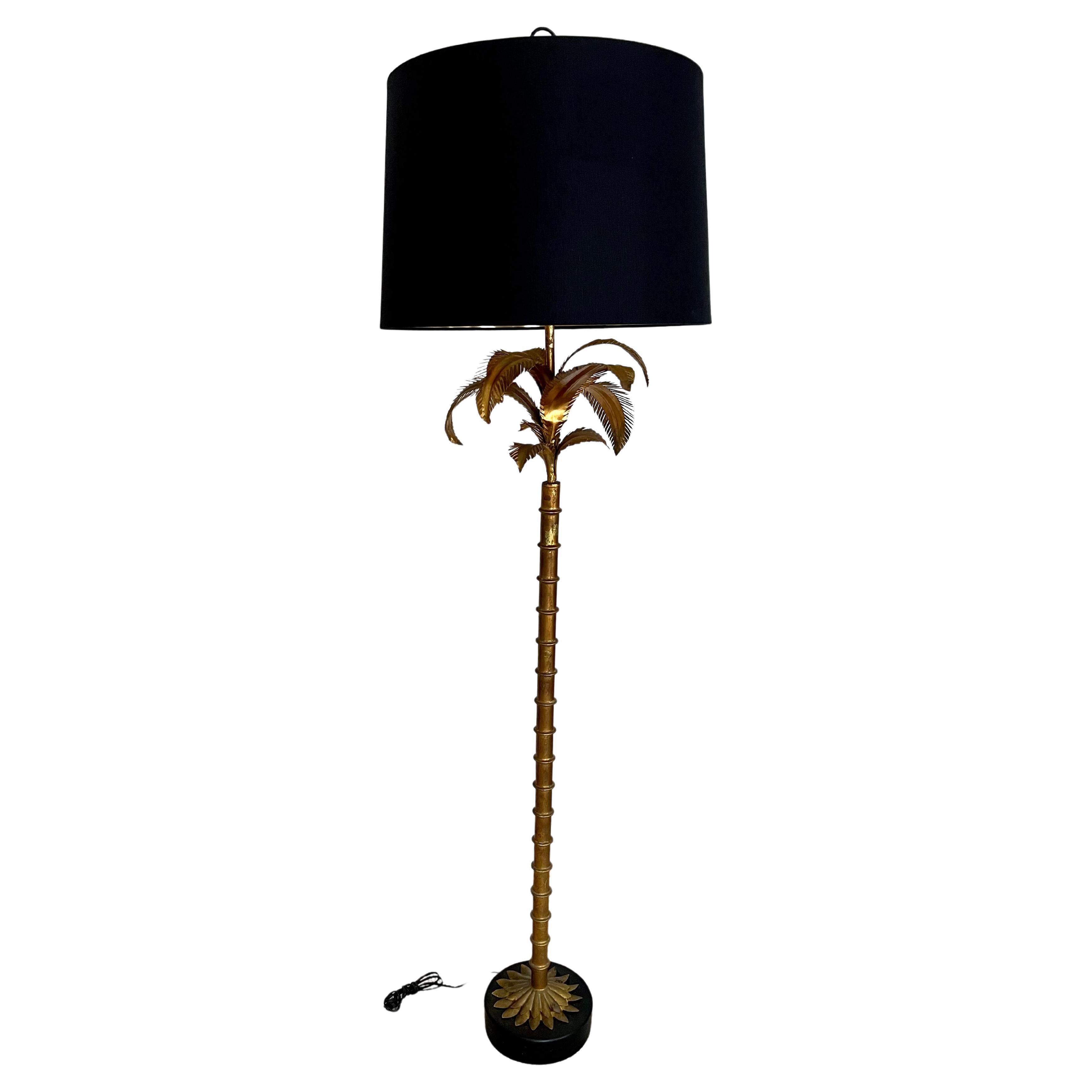 A wonderful example of Hollywood Regency in a Warren Kessler floor lamp with Brass Bamboo and Palm leaves. A three dimensional, and very stunning piece. the linen shade, which is included has a gold foil interior, when lit the glow is very sexy and